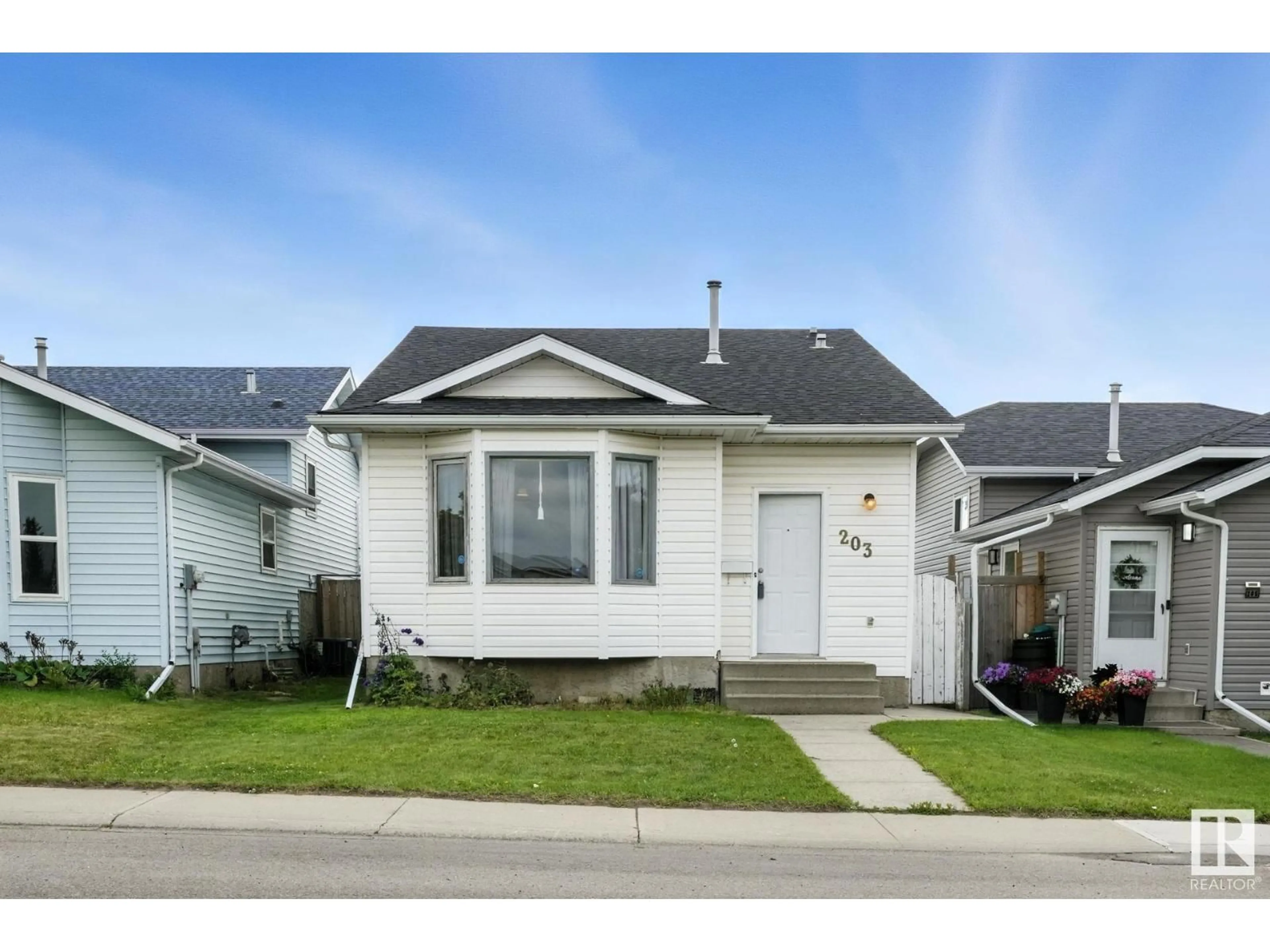 Home with vinyl exterior material, street for 203 KIRKWOOD AV, Edmonton Alberta T6L6K7