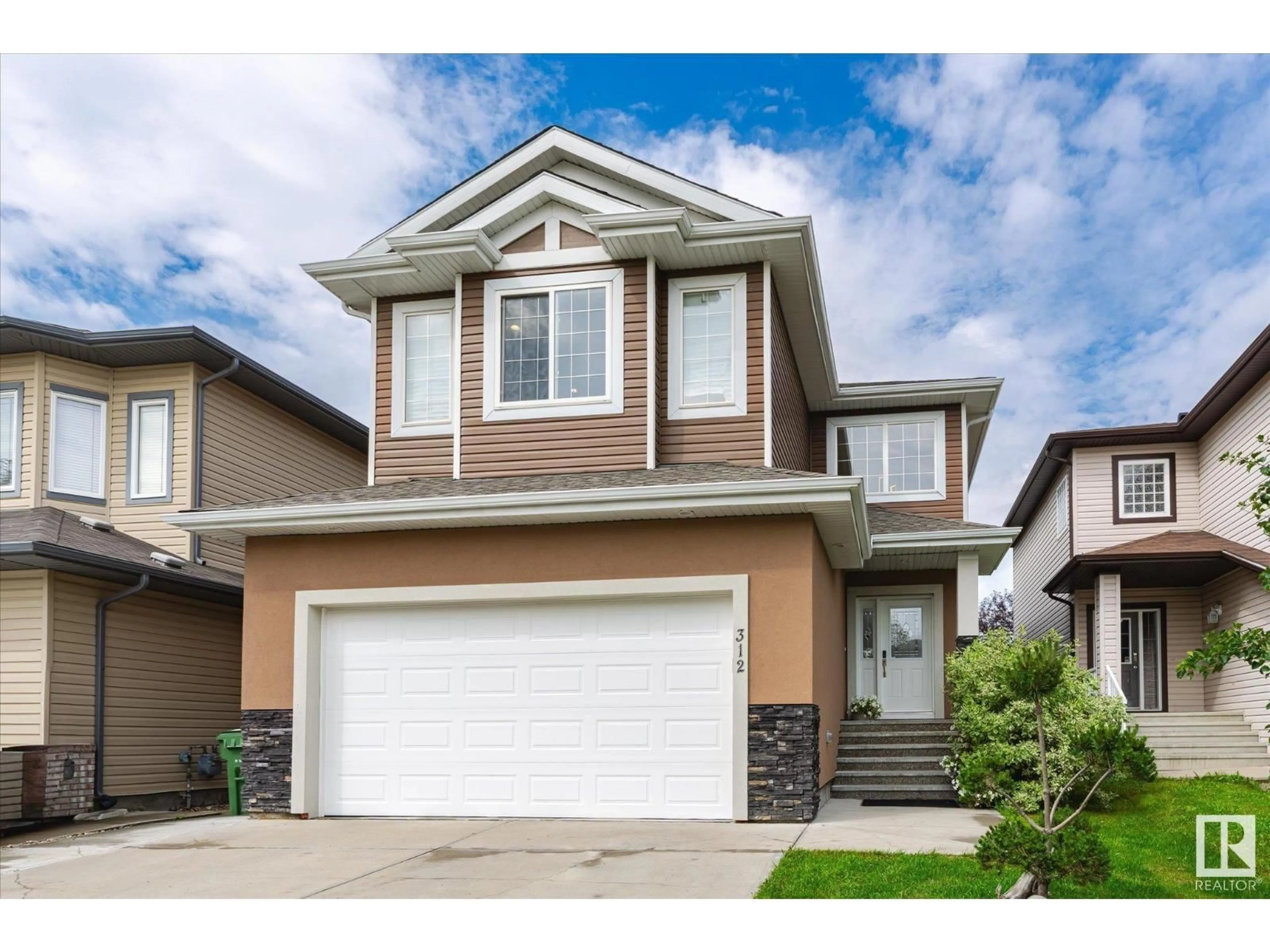 Home with vinyl exterior material, street for 312 AVENA LI, Leduc Alberta T9E0P2