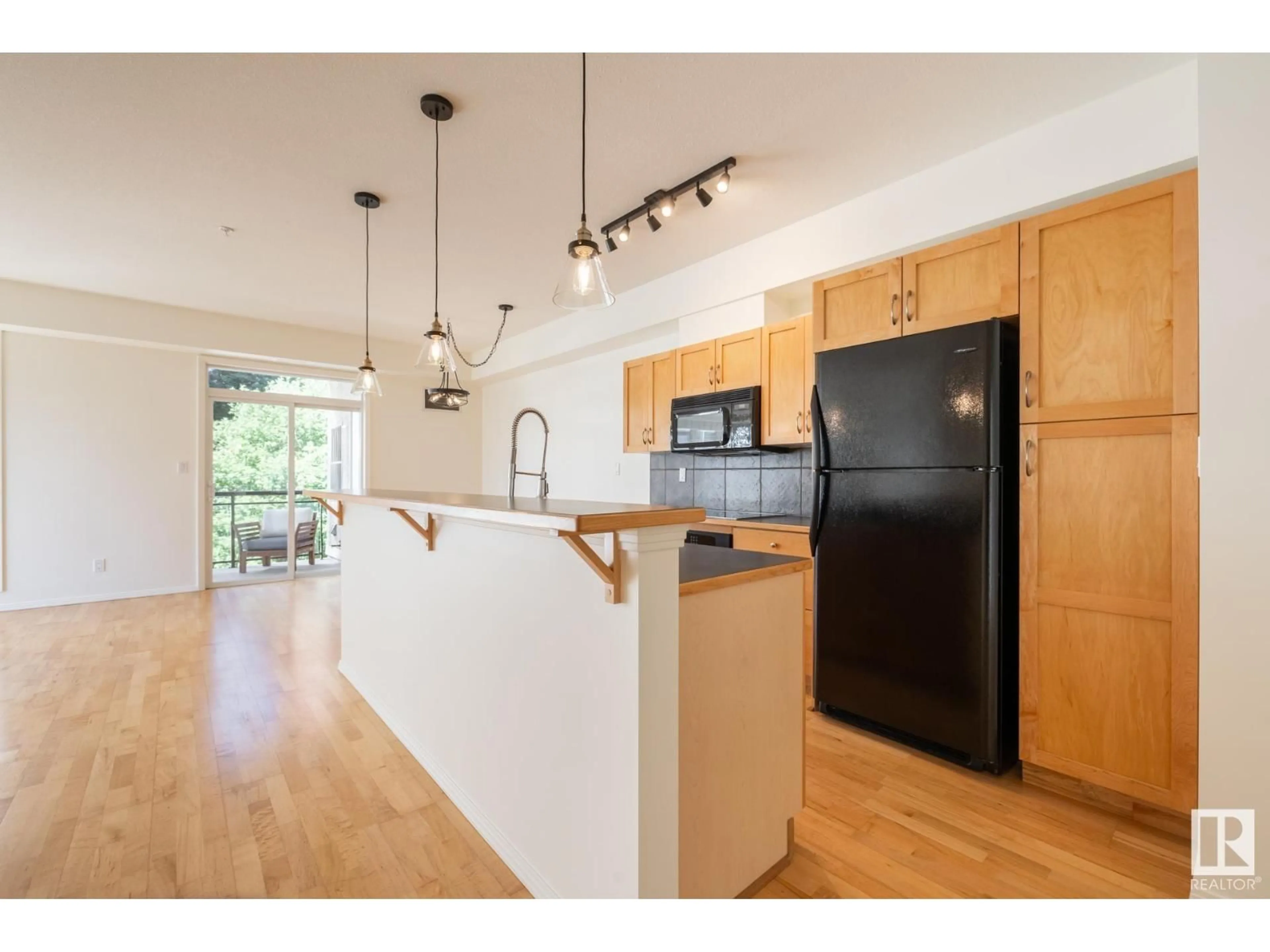 Open concept kitchen, wood/laminate floor for #409 - 10503 98 AV, Edmonton Alberta T5K0B2