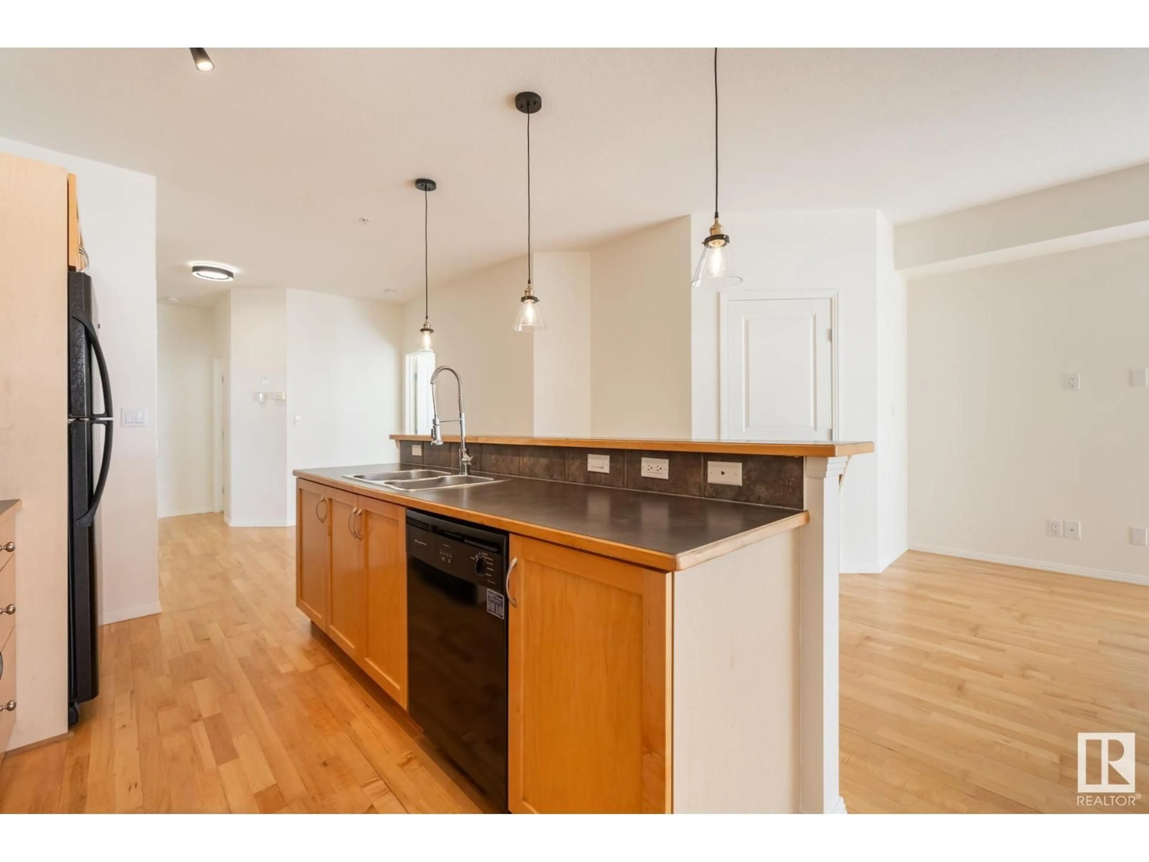 Open concept kitchen, wood/laminate floor for #409 - 10503 98 AV, Edmonton Alberta T5K0B2