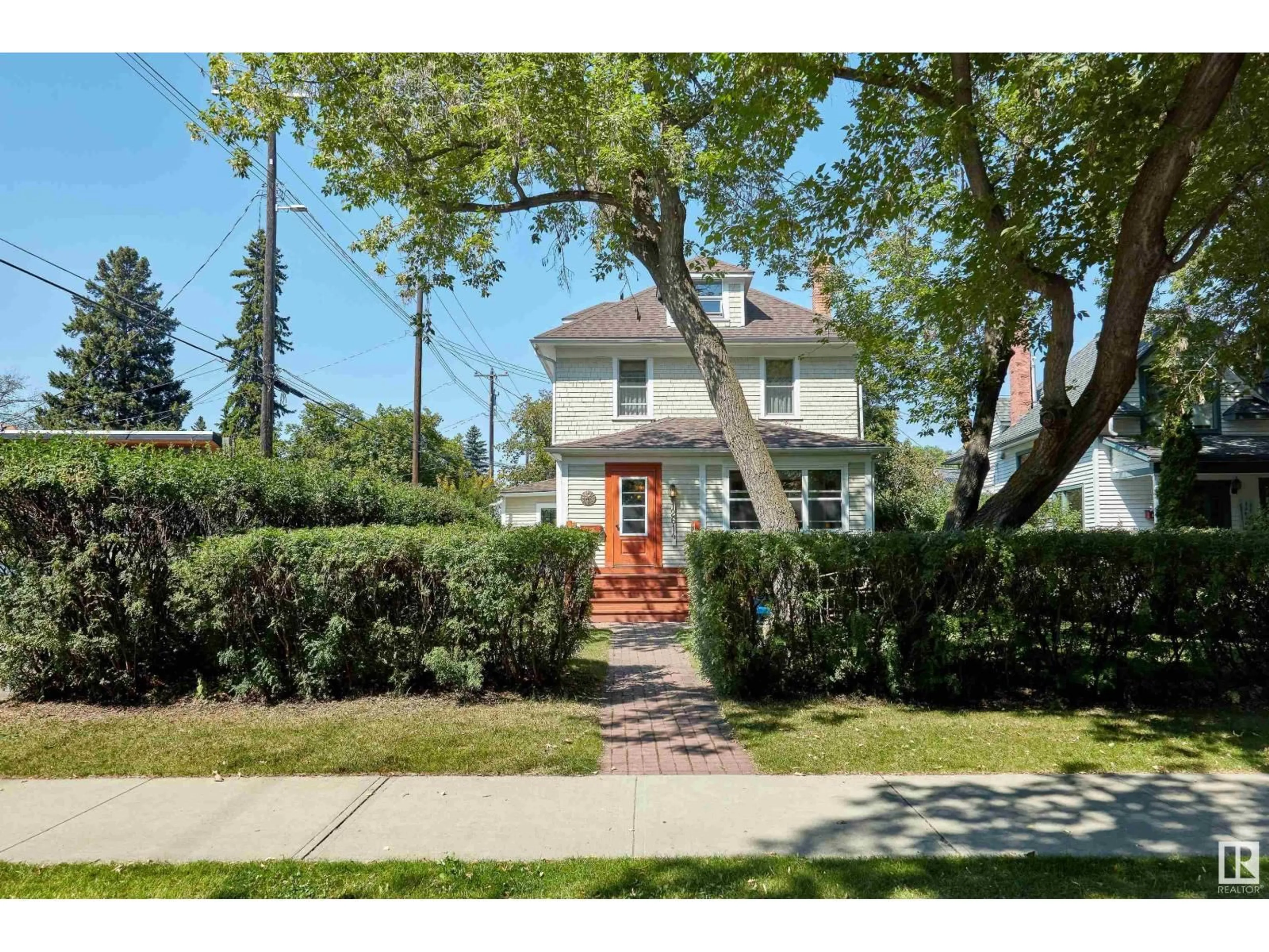 Home with brick exterior material, street for 12614 106 AV, Edmonton Alberta T5N0Z7