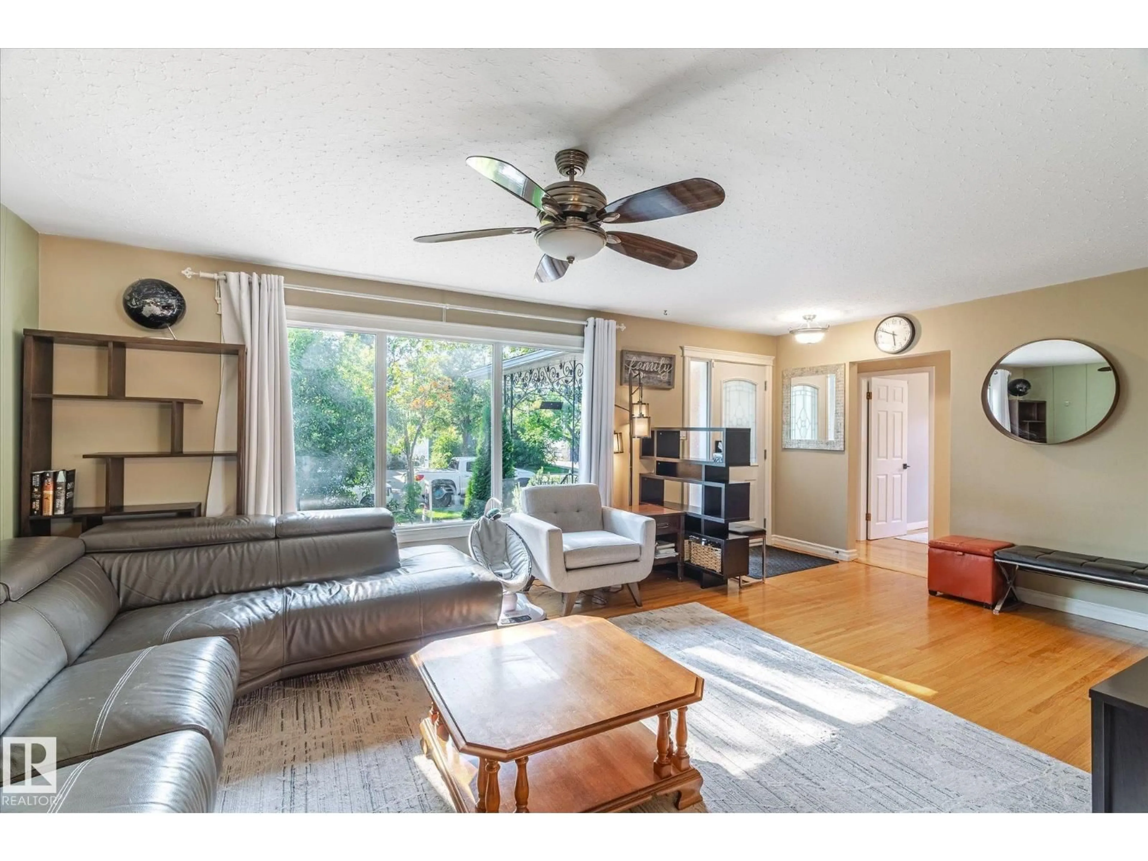 Living room with furniture, wood/laminate floor for 13107 102 ST, Edmonton Alberta T5E4J6