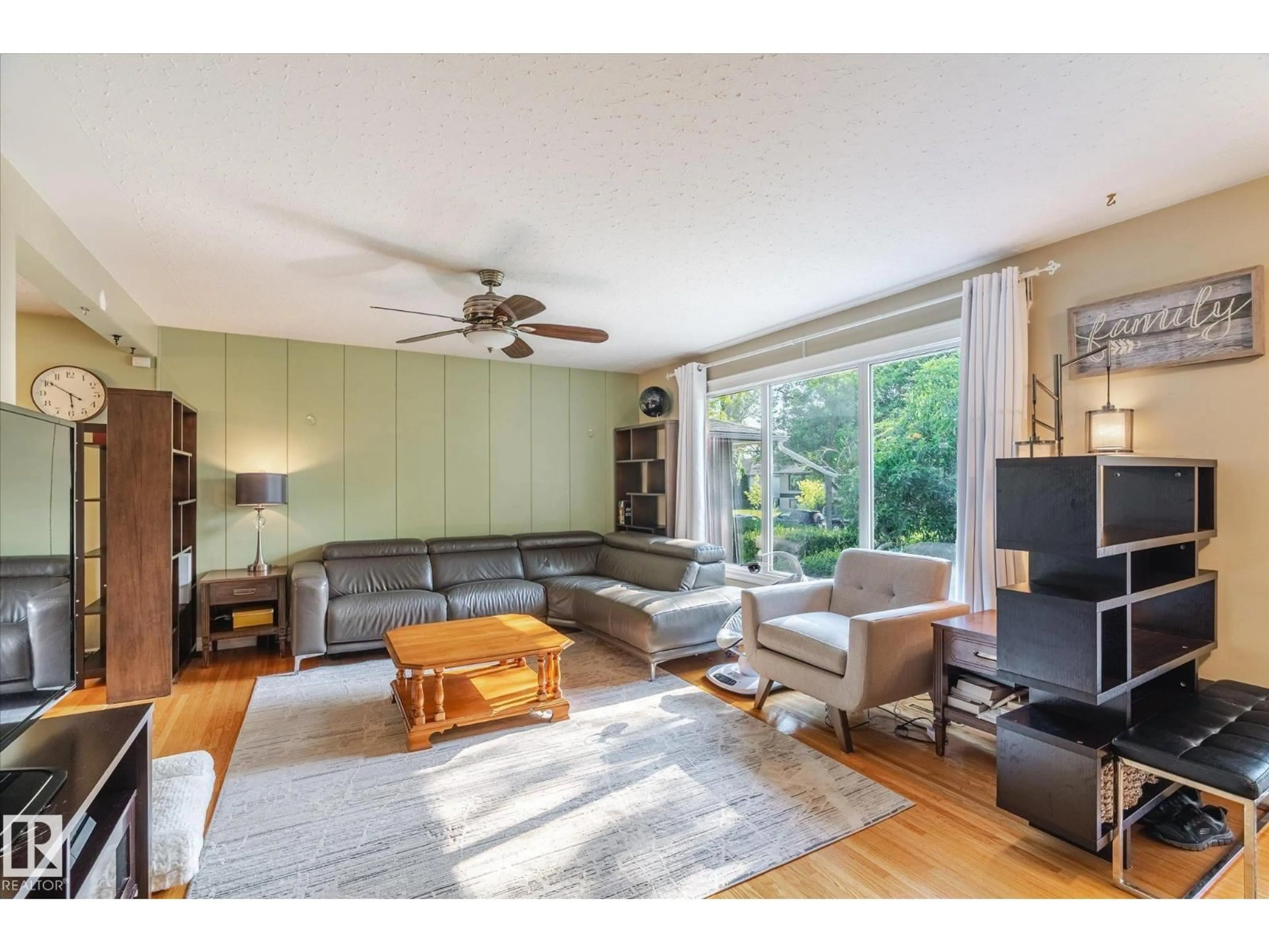 Living room with furniture, wood/laminate floor for 13107 102 ST, Edmonton Alberta T5E4J6