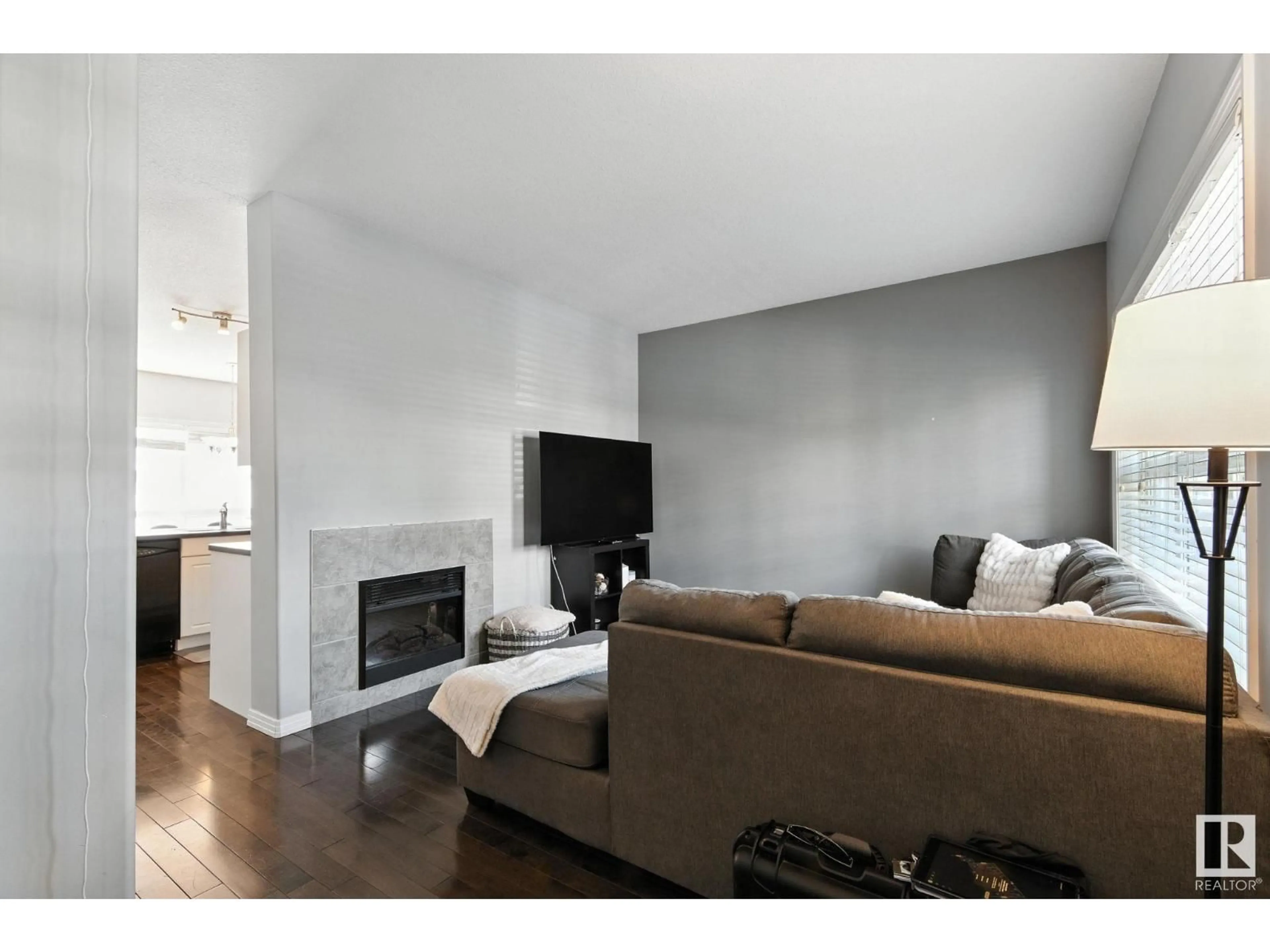 Living room with furniture, wood/laminate floor for 4481 MCCRAE AV, Edmonton Alberta T5E4G6