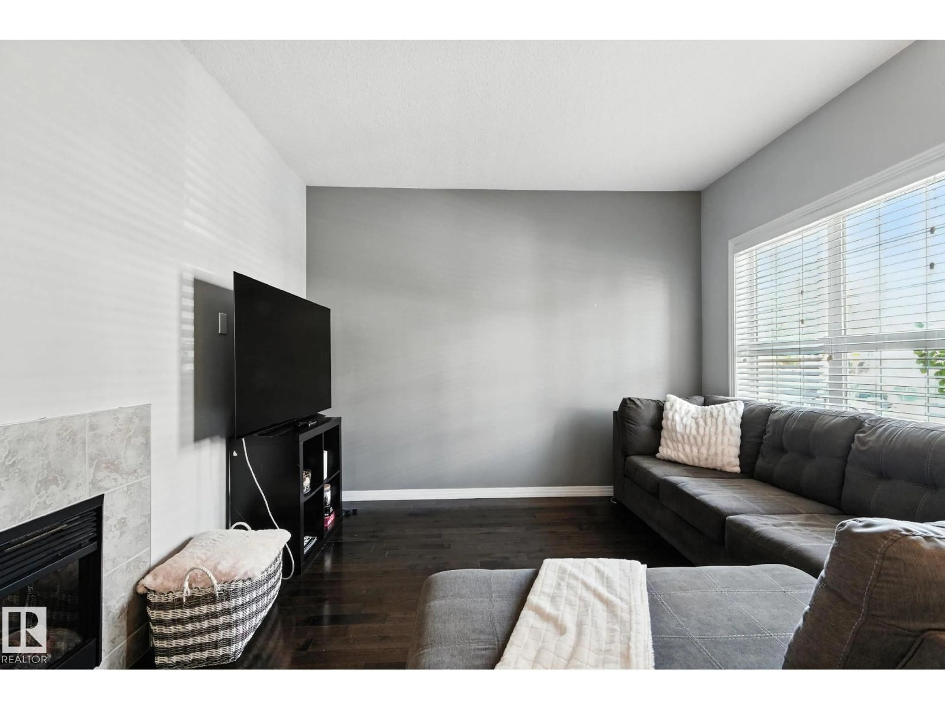 Living room with furniture, wood/laminate floor for 4481 MCCRAE AV, Edmonton Alberta T5E4G6