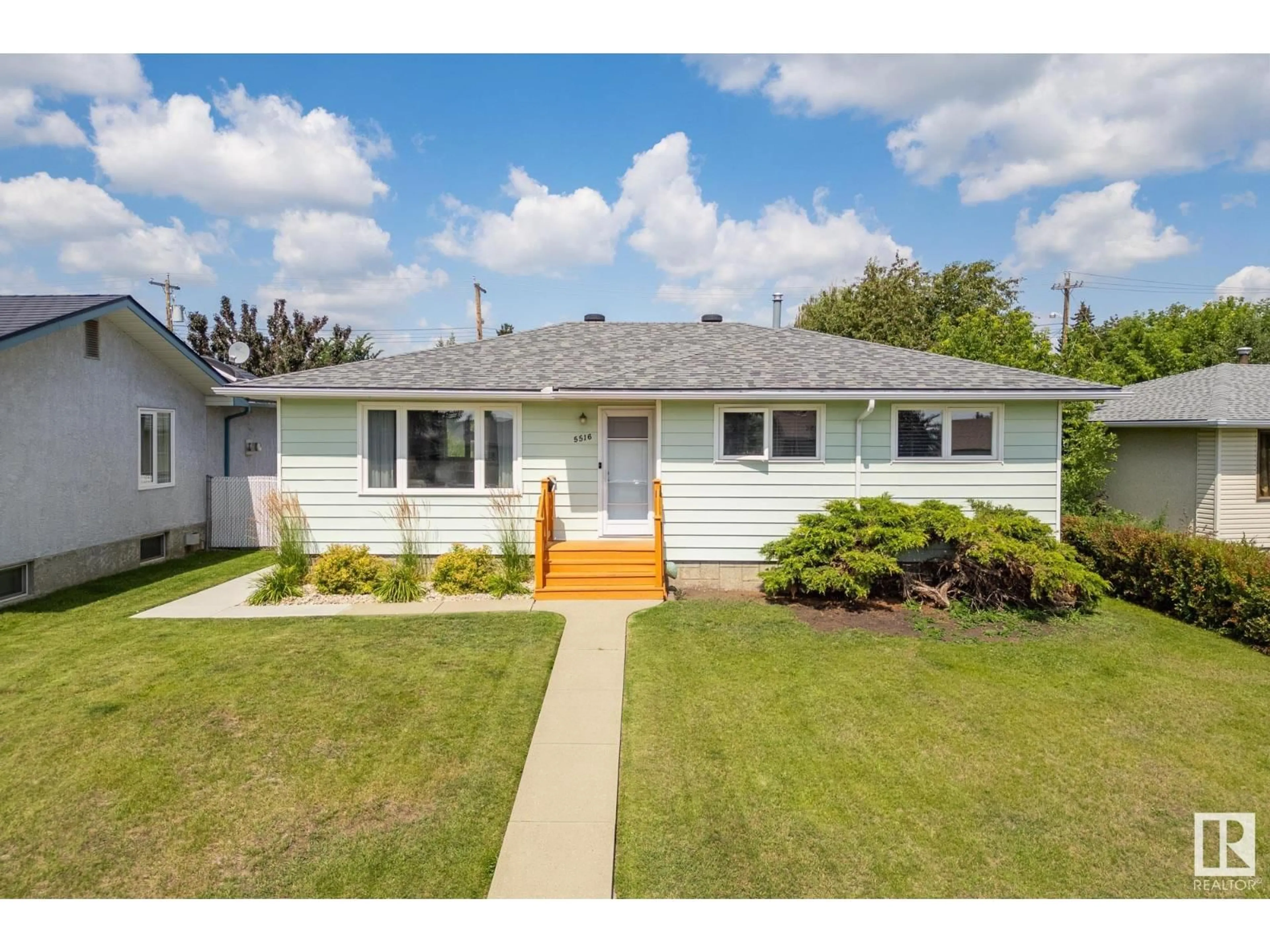 Home with vinyl exterior material, street for 5516 140A AV, Edmonton Alberta T5A1H3