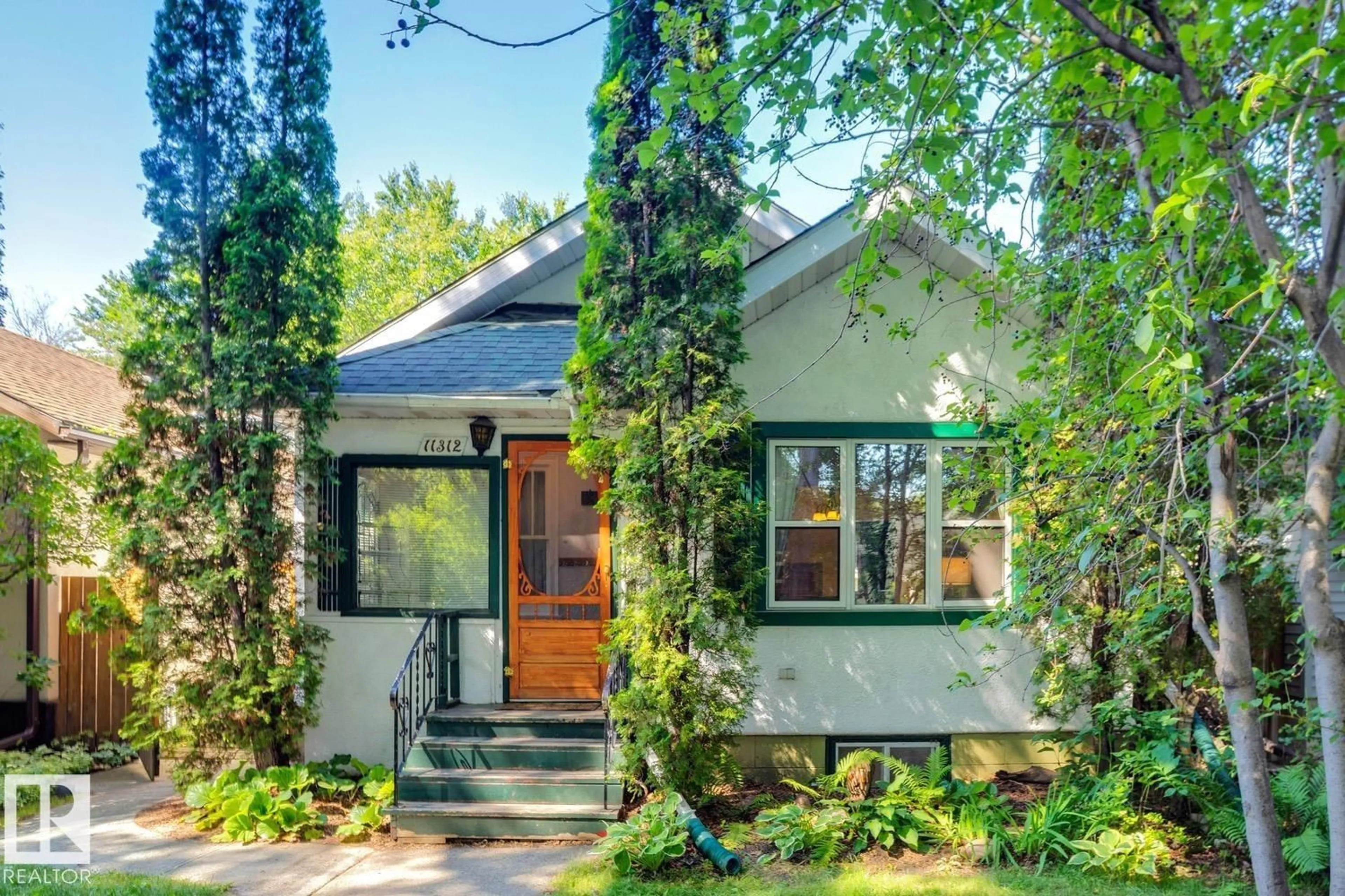 Home with brick exterior material, street for NW - 11312 66 ST, Edmonton Alberta T5B1H6