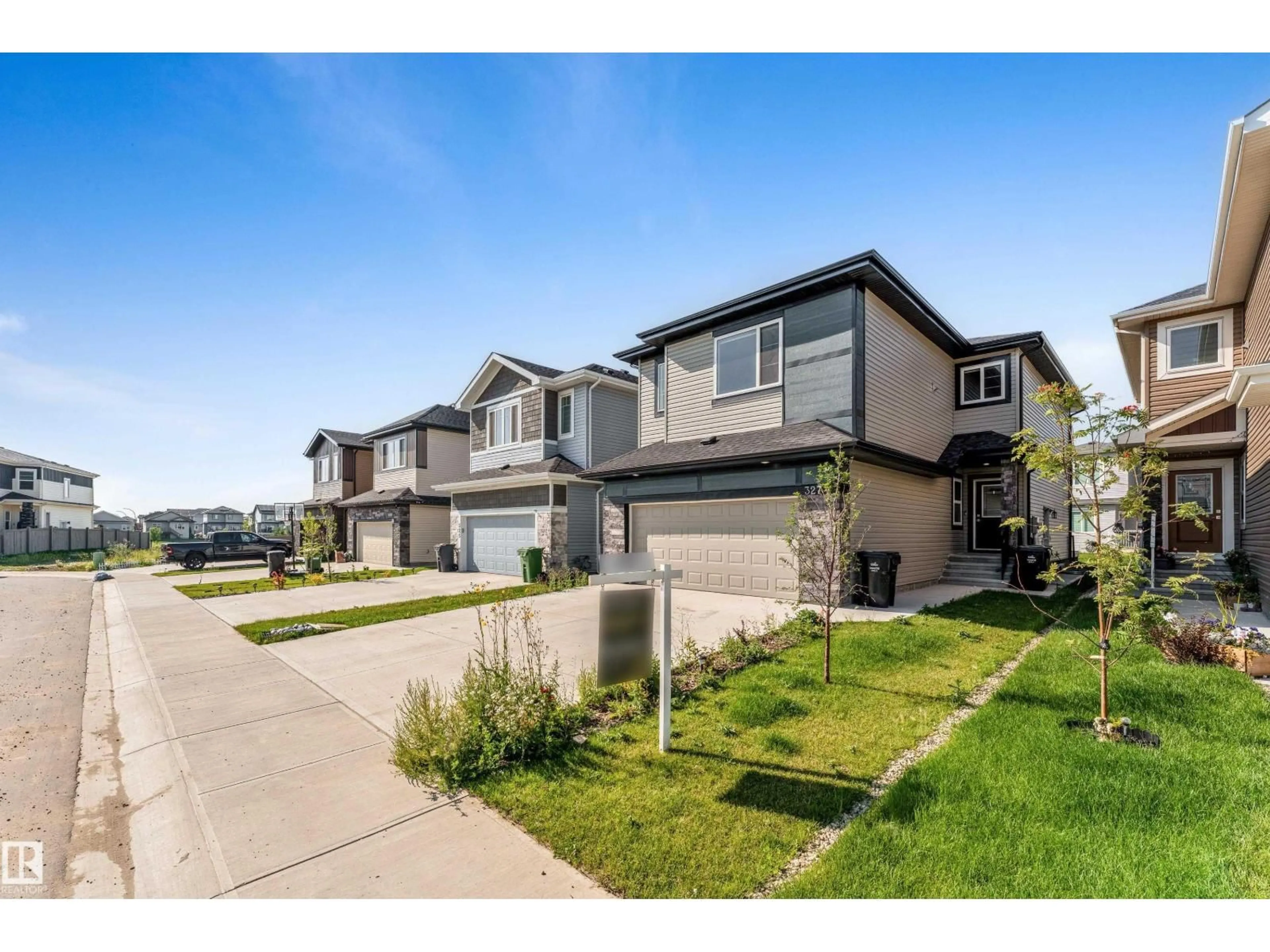A pic from outside/outdoor area/front of a property/back of a property/a pic from drone, street for 327 ROBERTS WD, Leduc Alberta T9E1P9