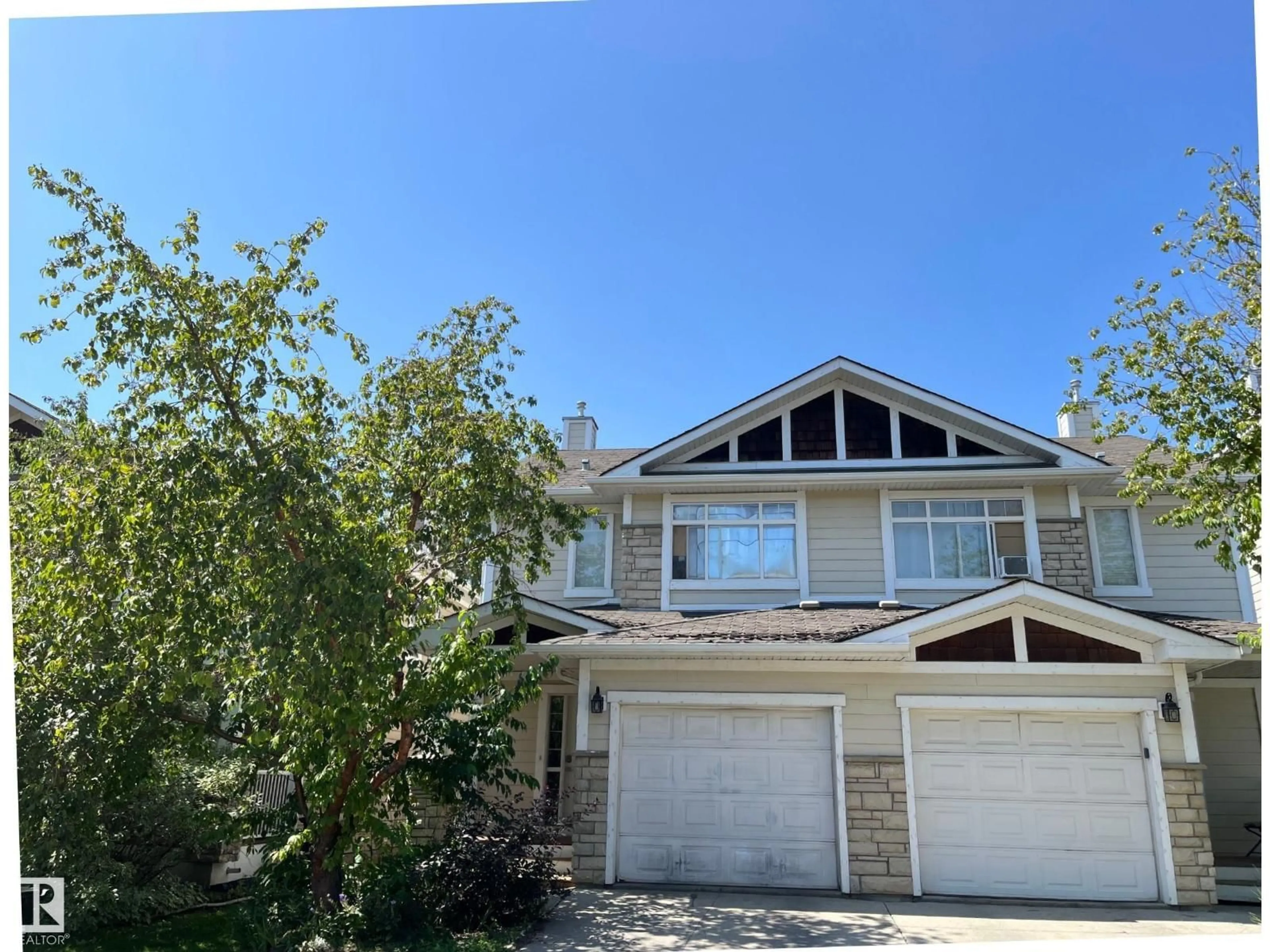 Home with vinyl exterior material, street for 24 - 6410 134 AV, Edmonton Alberta T5A0A1