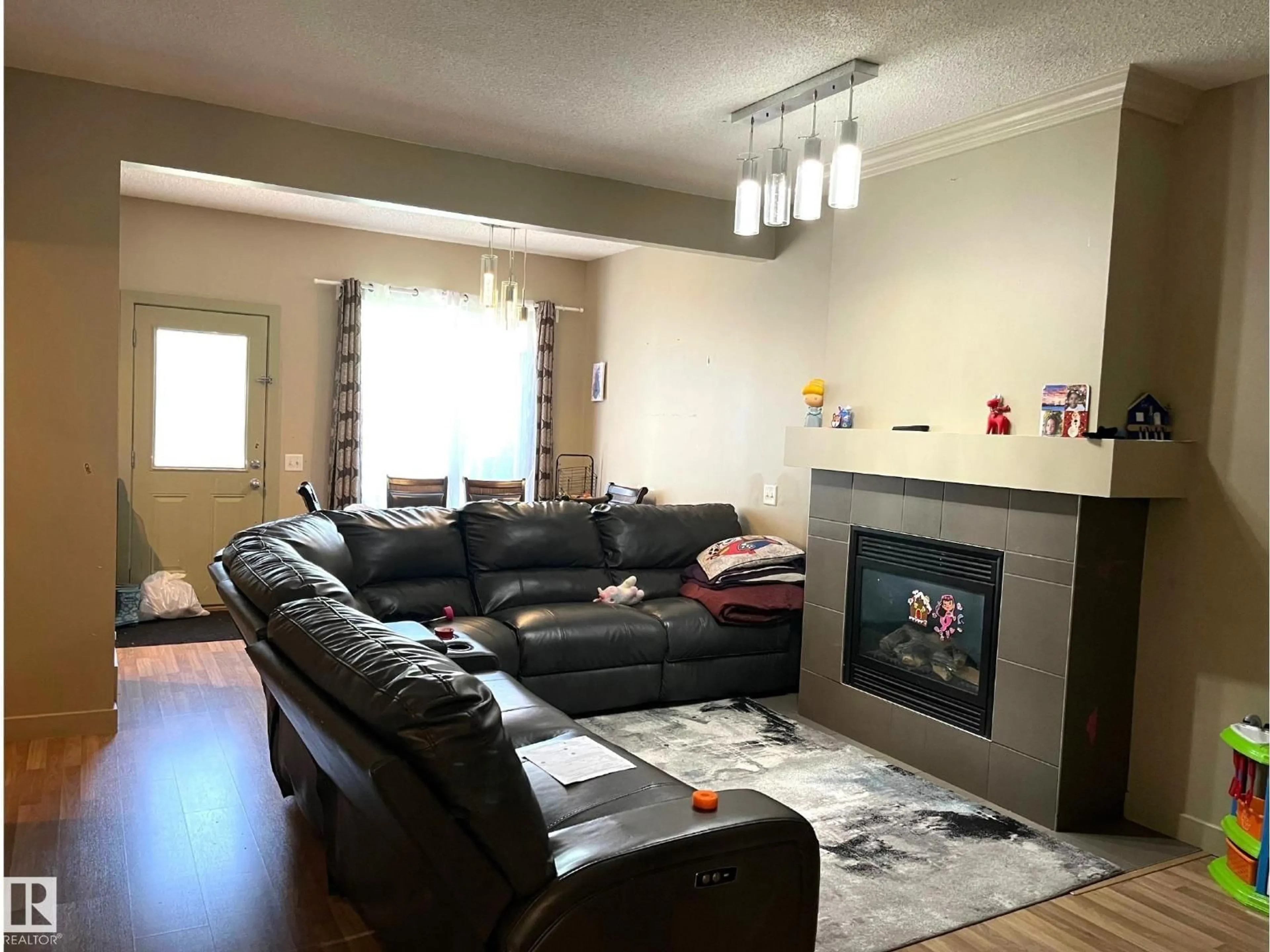Living room with furniture, unknown for 24 - 6410 134 AV, Edmonton Alberta T5A0A1