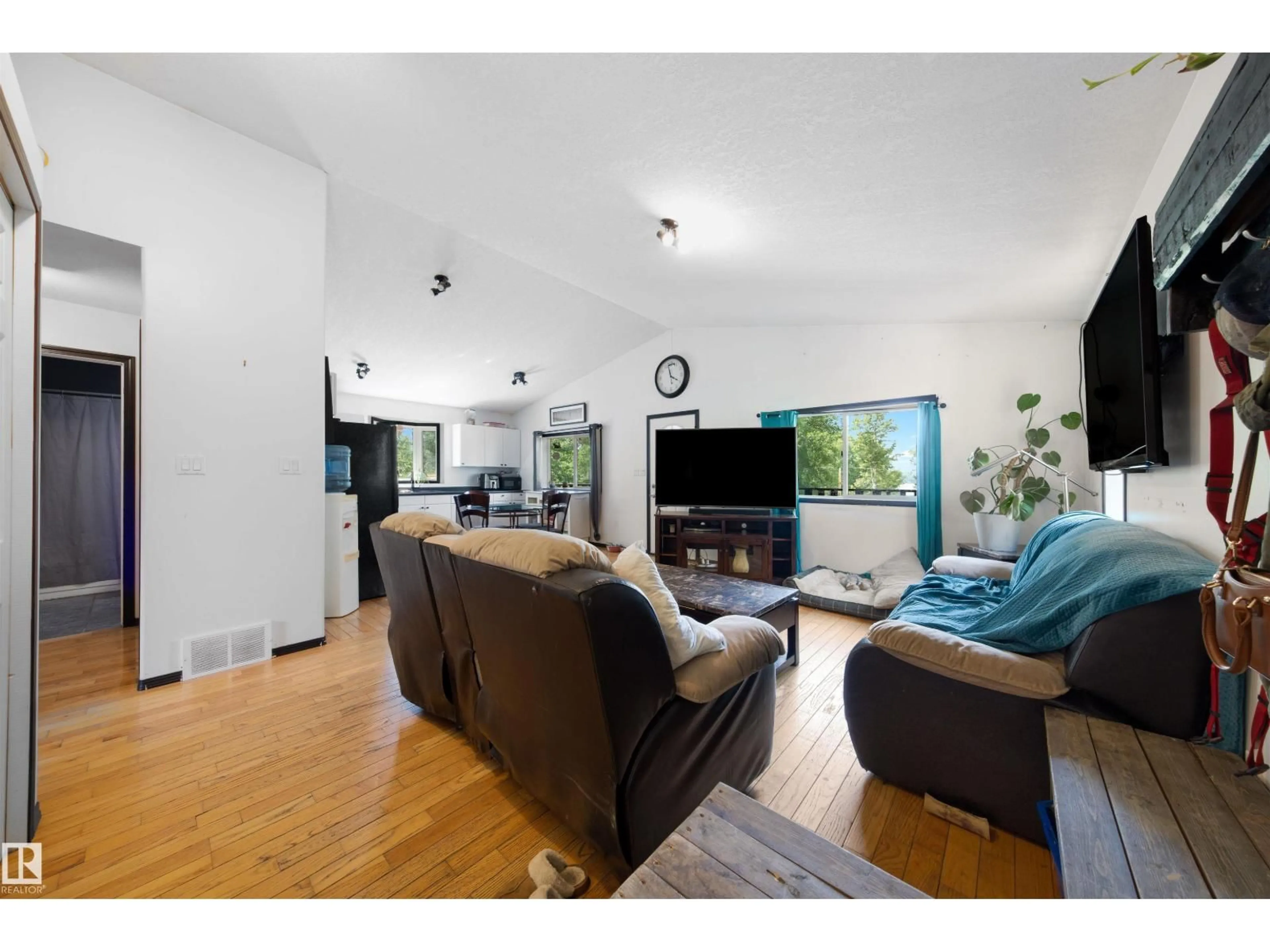 Living room with furniture, wood/laminate floor for #11 - 6020 TWP ROAD 534, Rural Parkland County Alberta T0E0W0