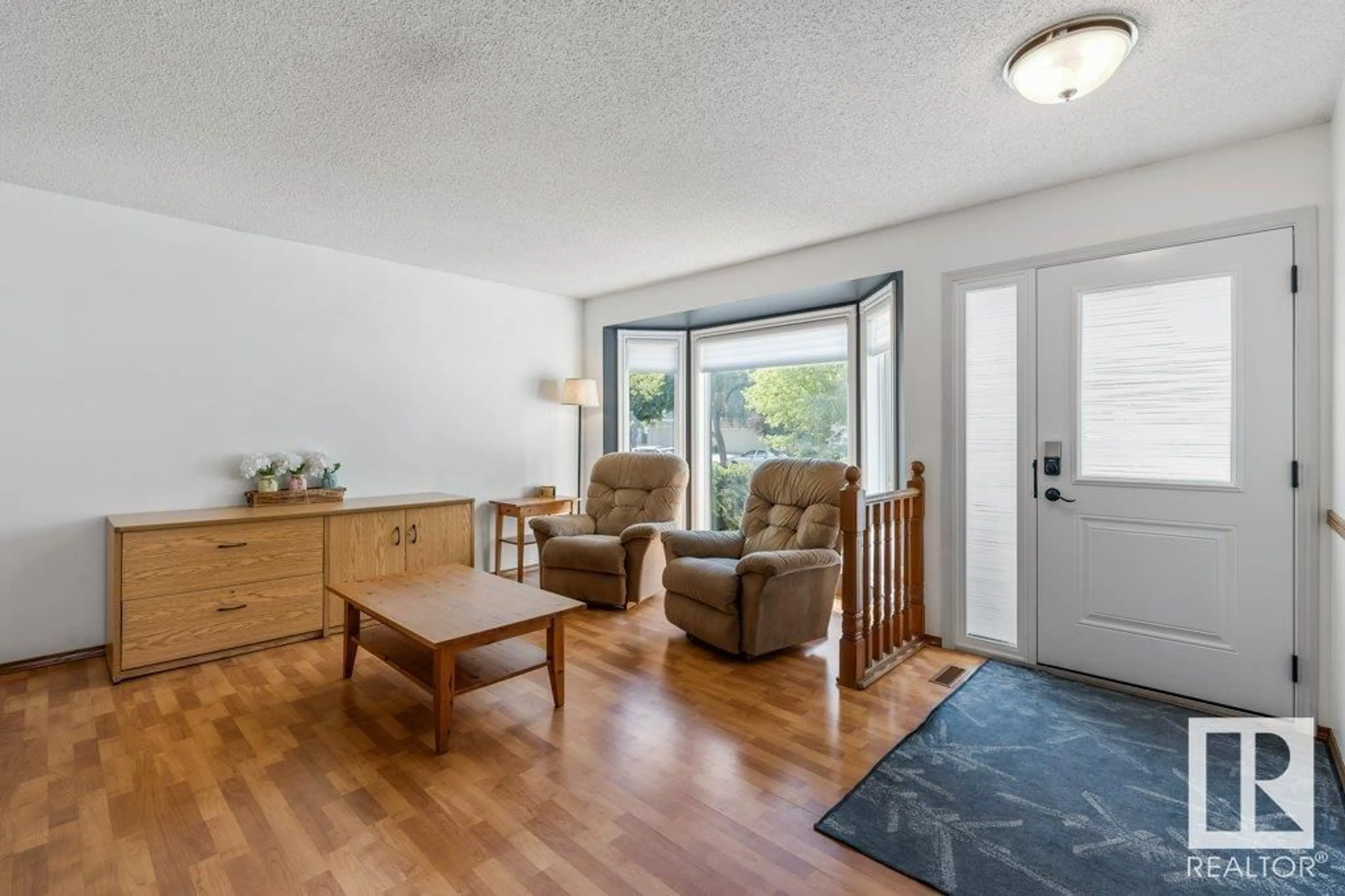 Living room with furniture, wood/laminate floor for 51 ALDERWOOD BLVD, St. Albert Alberta T8N3M4