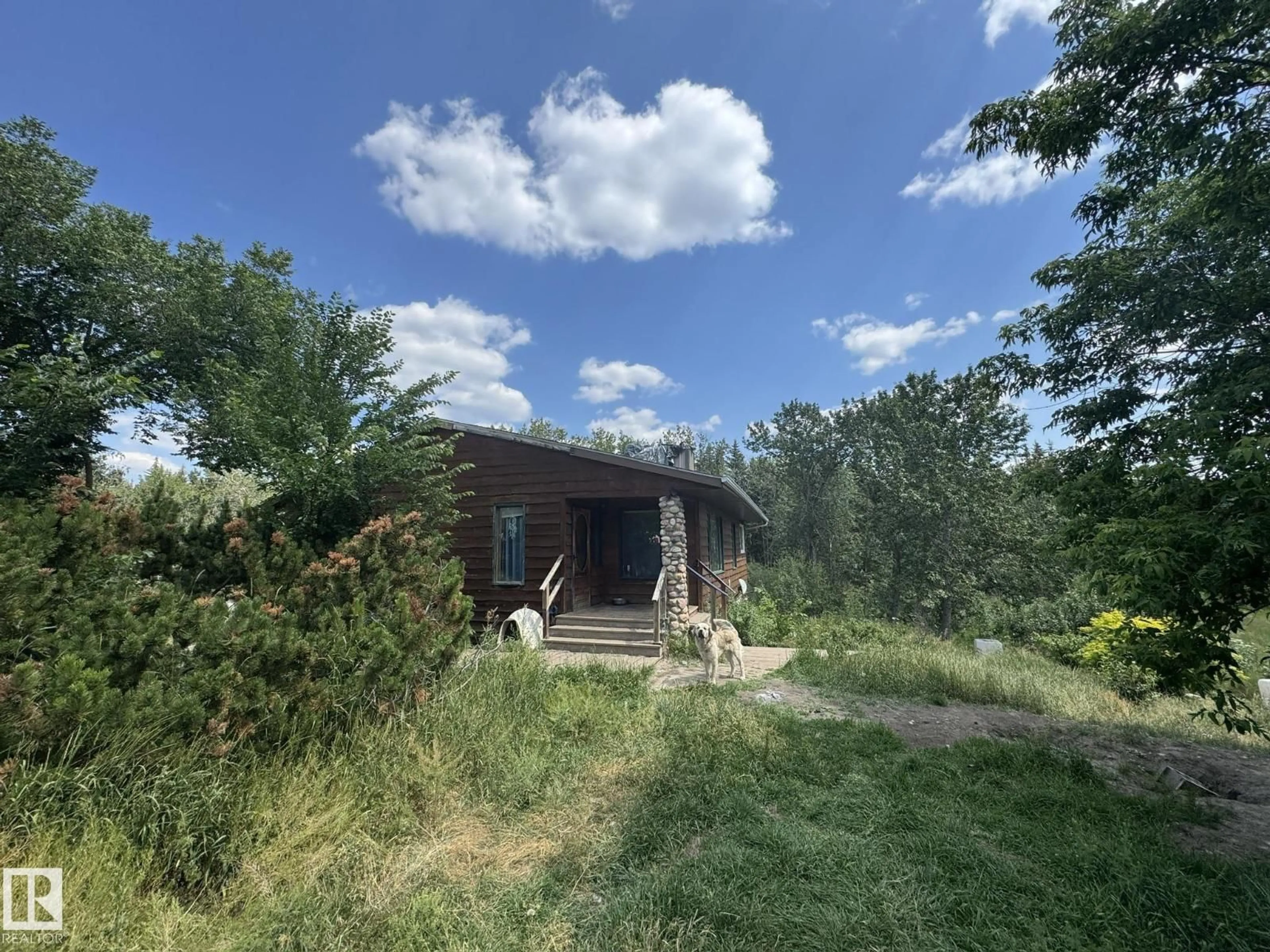 A pic from outside/outdoor area/front of a property/back of a property/a pic from drone, forest/trees view for 57527A 41 HI, Rural St. Paul County Alberta T0A0B9