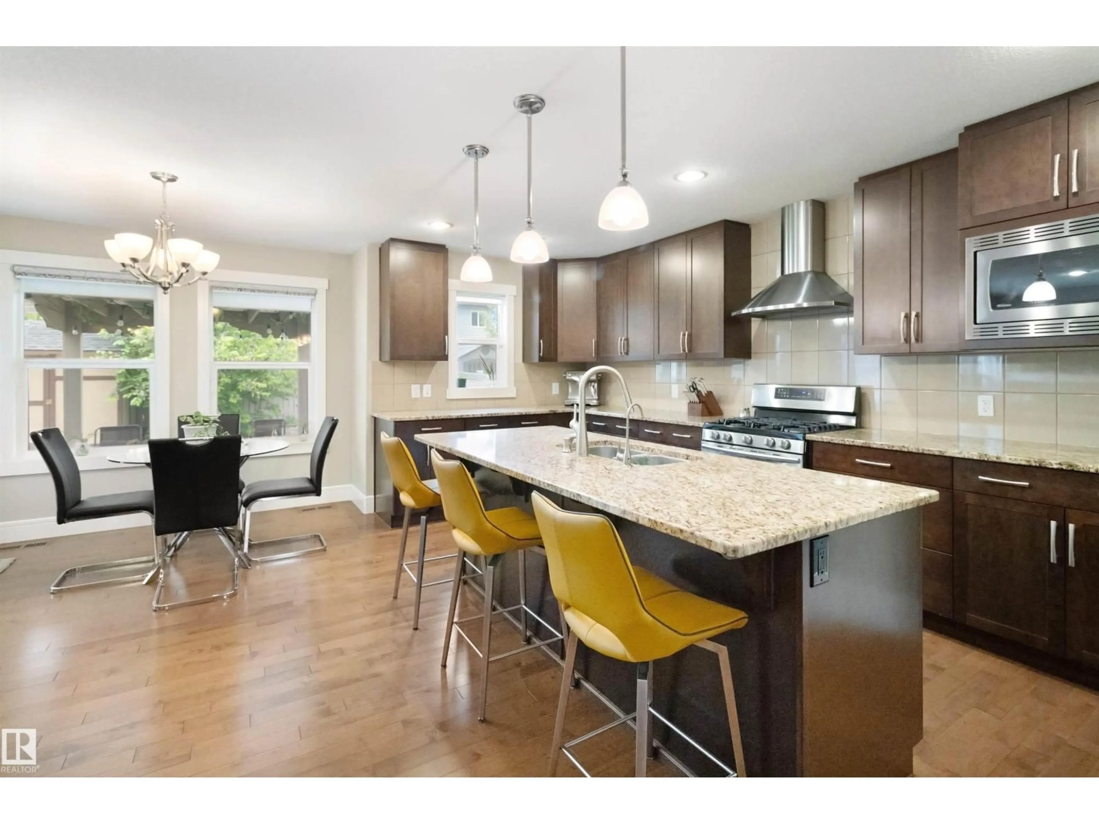 Open concept kitchen, wood/laminate floor for 7599 ELLESMERE WY, Sherwood Park Alberta T8H0P7