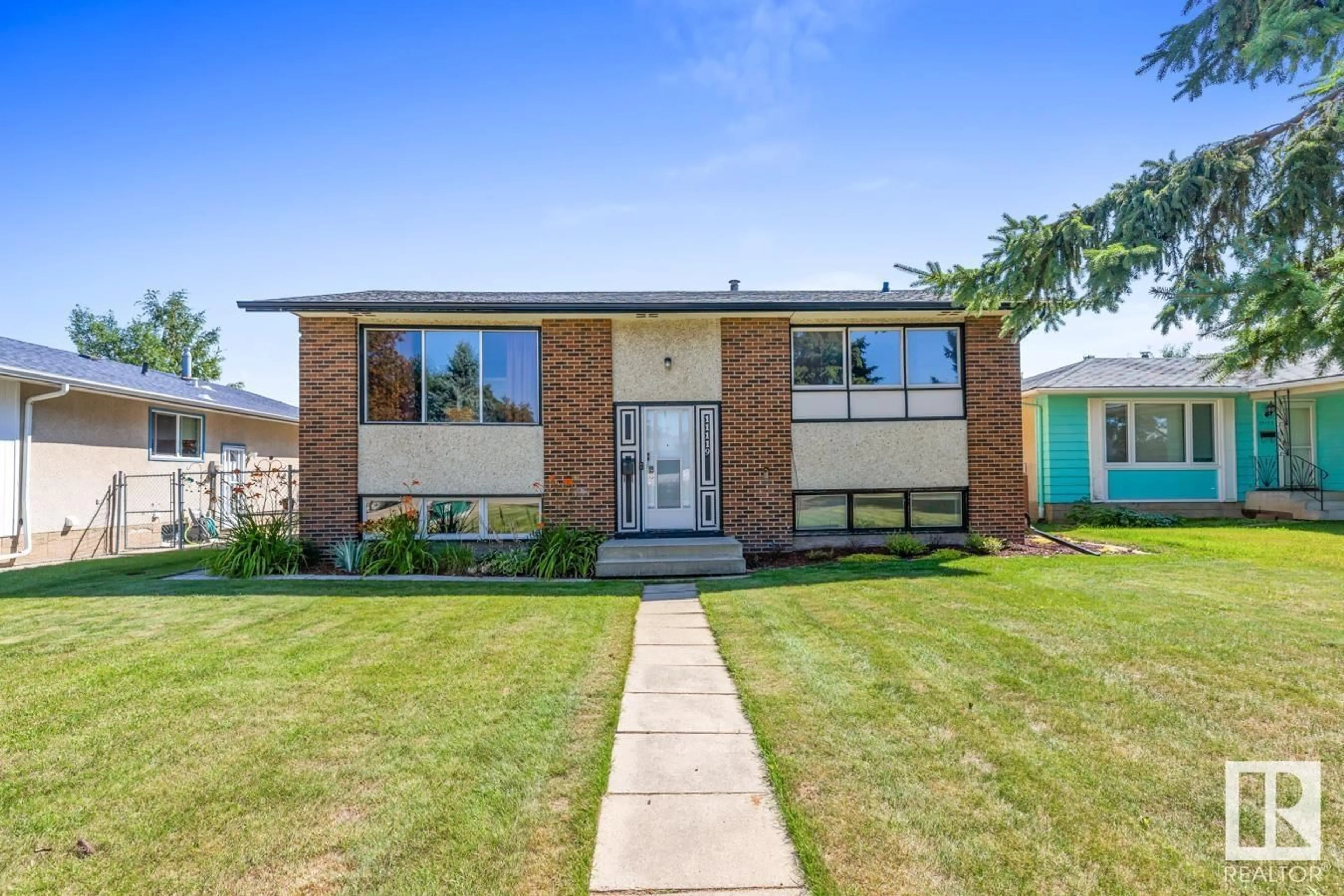 Home with brick exterior material, street for 11119 34 ST, Edmonton Alberta T5W1Y8