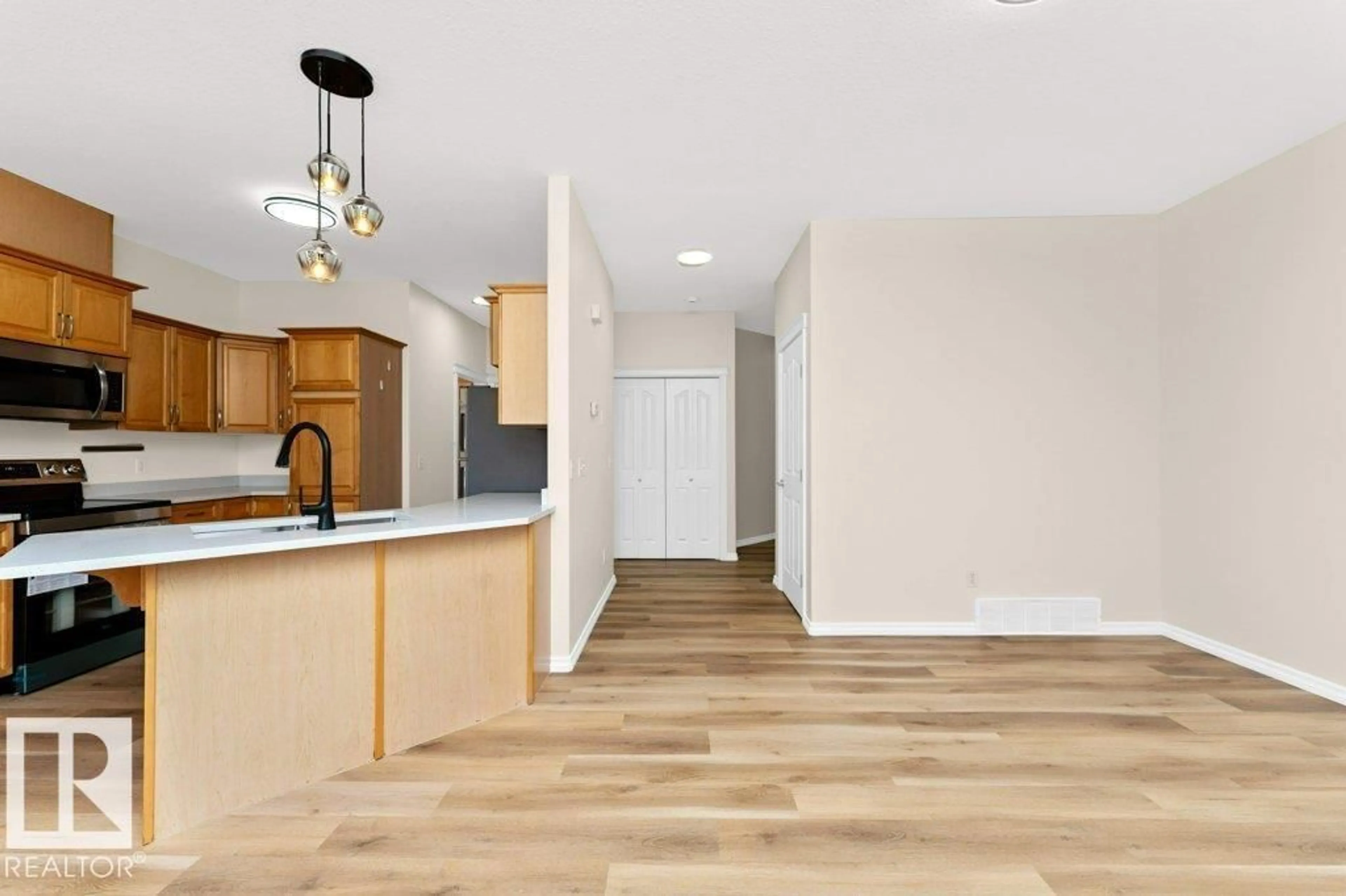 Open concept kitchen, wood/laminate floor for 39 735 85 ST SW, Edmonton Alberta T6X0K5