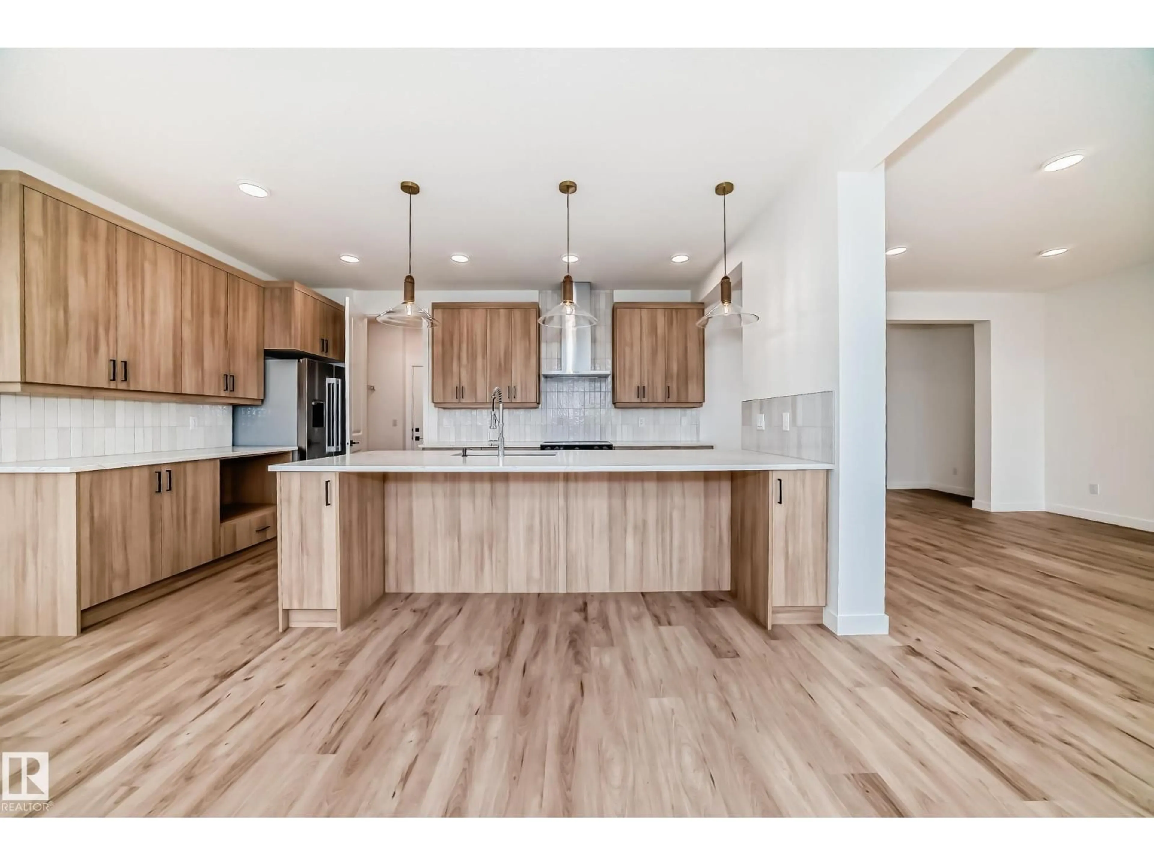 Open concept kitchen, wood/laminate floor for 5727 KOOTOOK WY, Edmonton Alberta T6W4V9