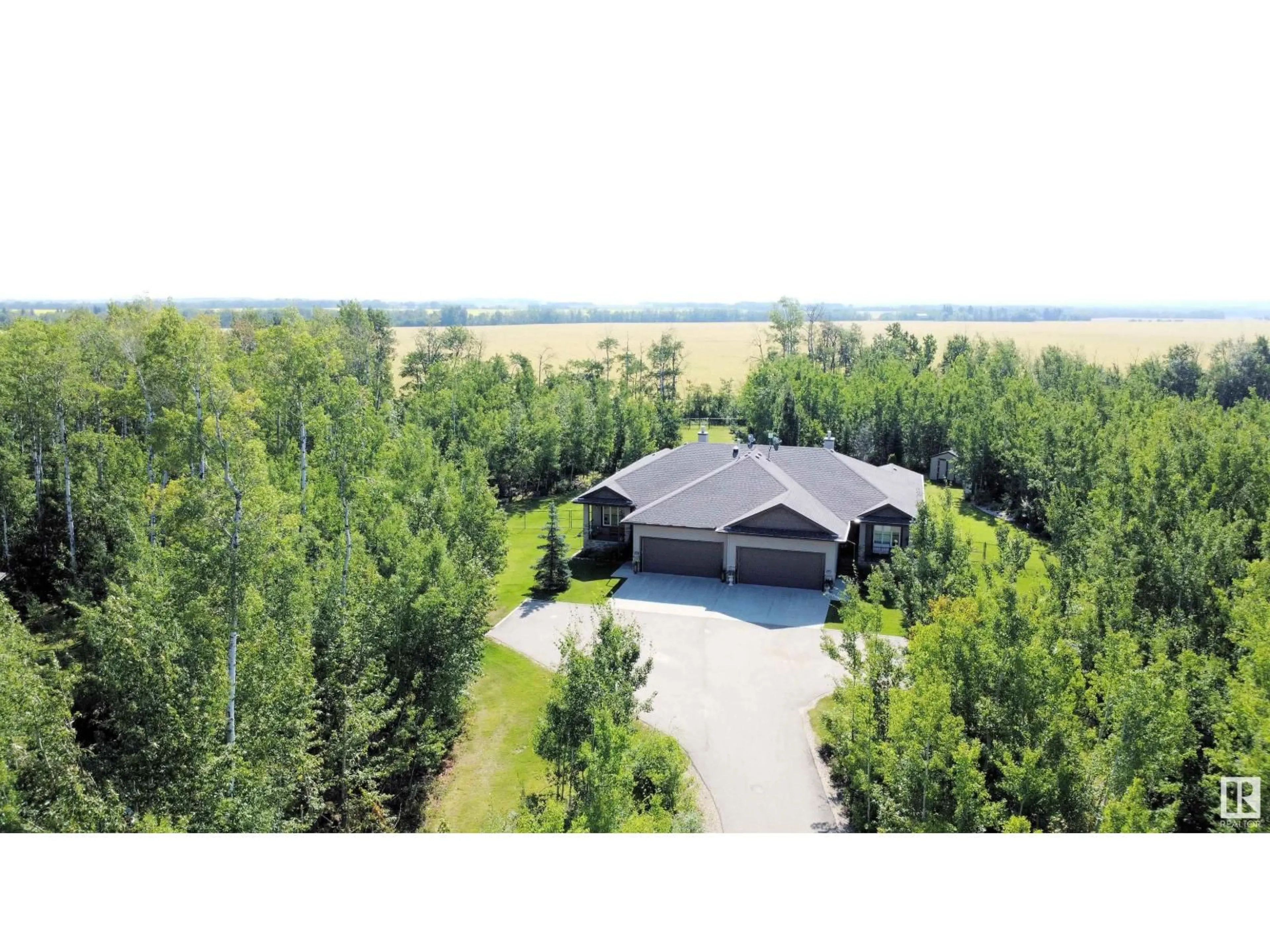 A pic from outside/outdoor area/front of a property/back of a property/a pic from drone, water/lake/river/ocean view for 25B RGE ROAD 272 RGE ROAD, Rural Parkland County Alberta T7X3M5