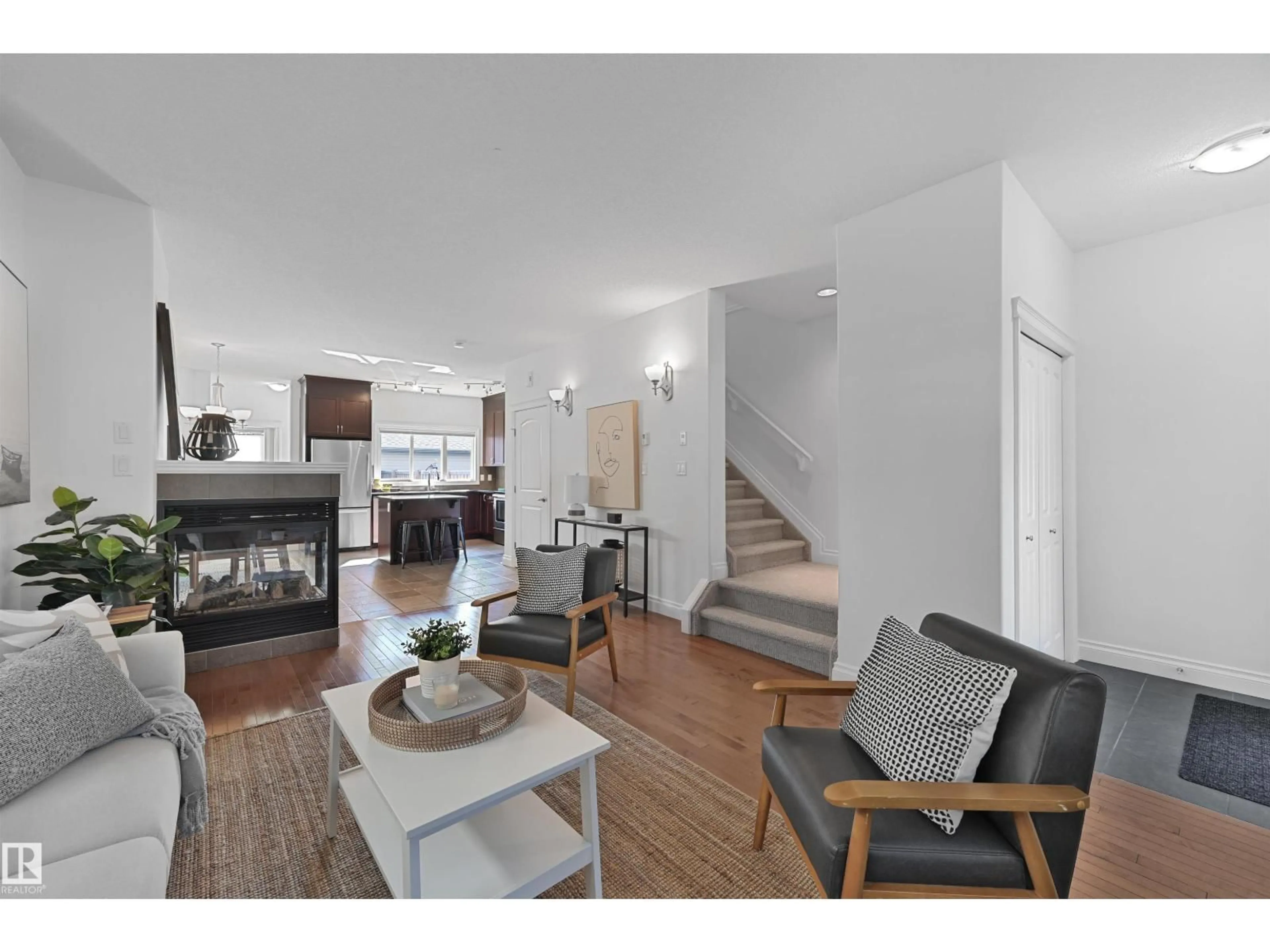 Living room with furniture, wood/laminate floor for 4909 TERWILLEGAR CM, Edmonton Alberta T6R0P5