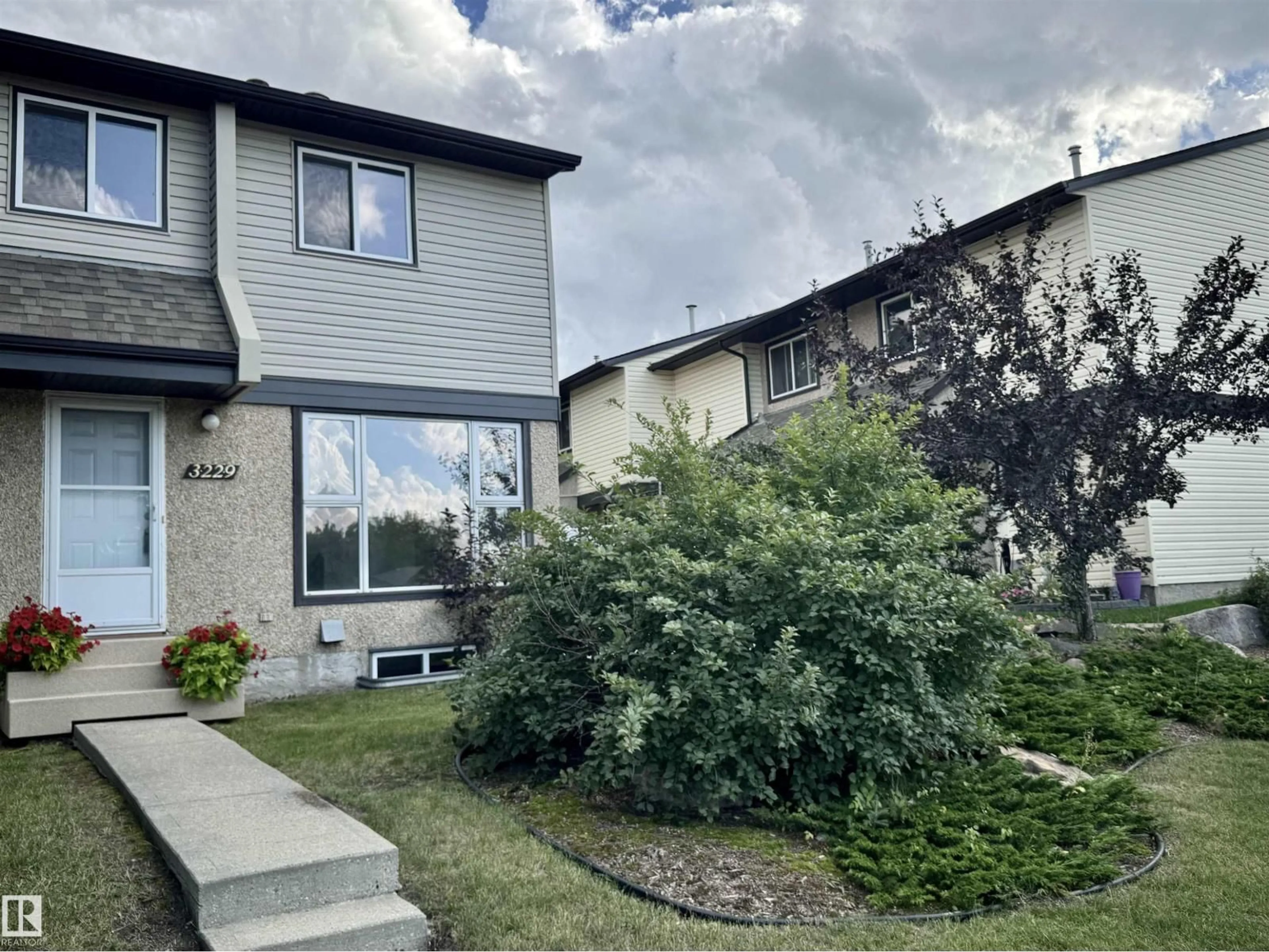 A pic from outside/outdoor area/front of a property/back of a property/a pic from drone, street for 3229 142 AV, Edmonton Alberta T5Y1H9