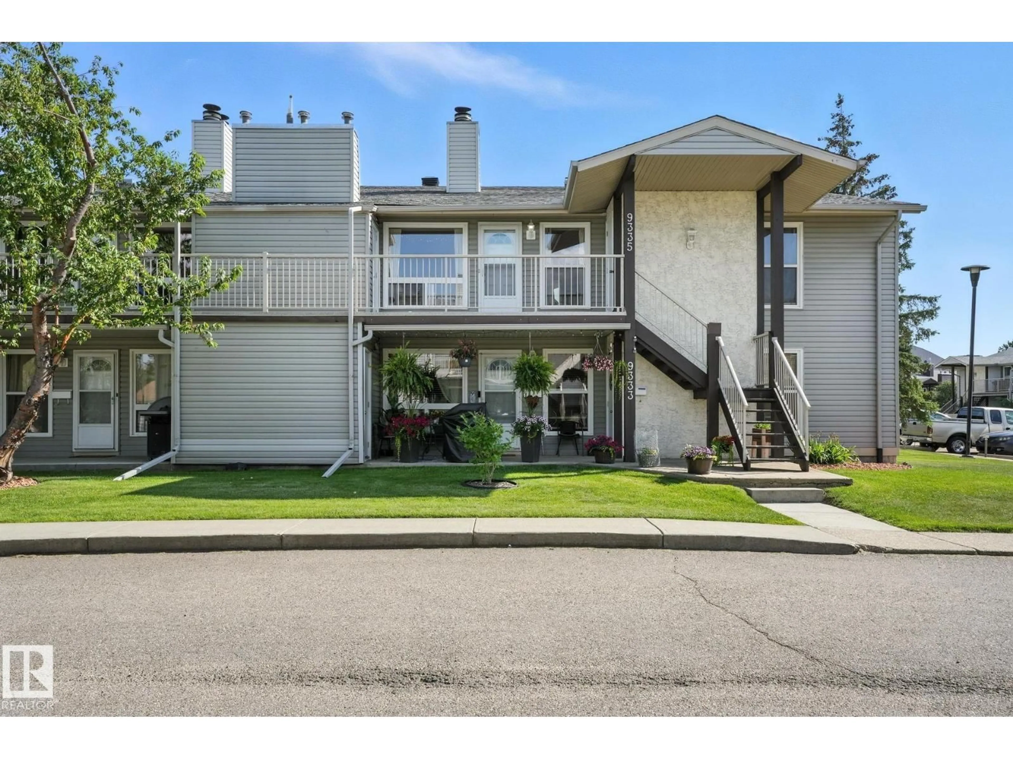 Home with vinyl exterior material, street for NW - 9335 172 ST, Edmonton Alberta T5T3C3