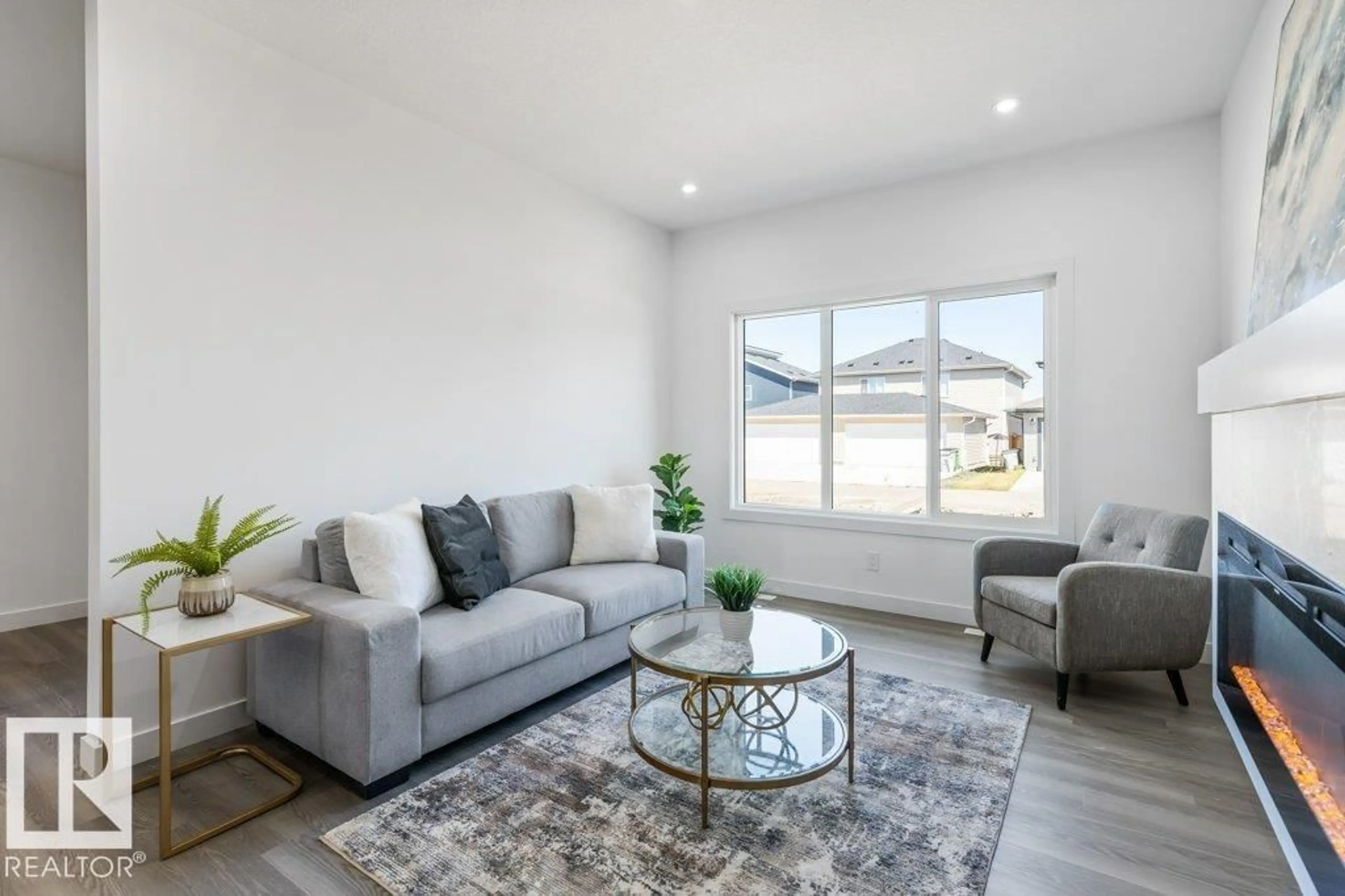 Living room with furniture, unknown for 10625 99 ST, Morinville Alberta T8R2P1
