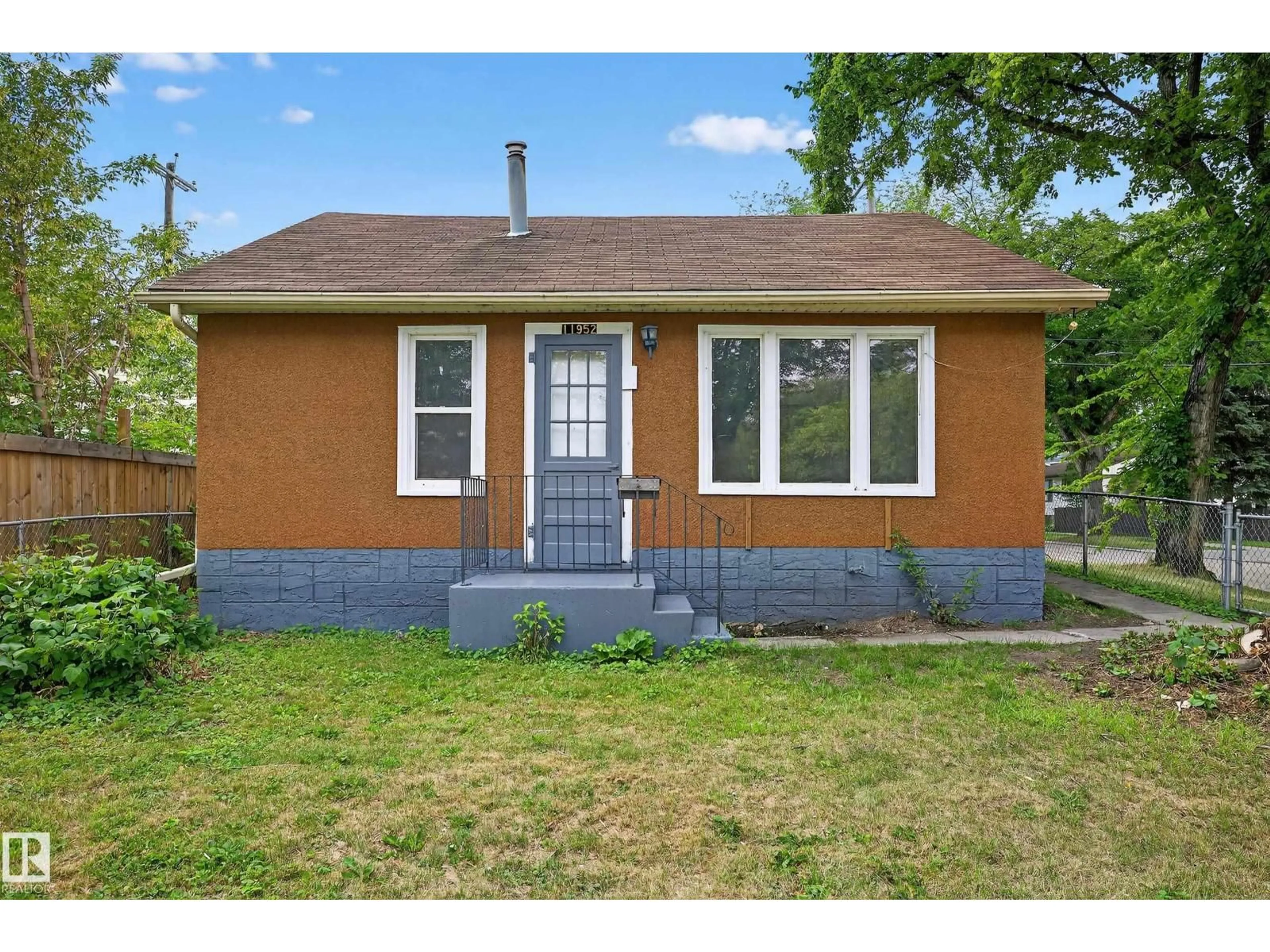 Home with vinyl exterior material, street for 11952 61 ST, Edmonton Alberta T5W4A9