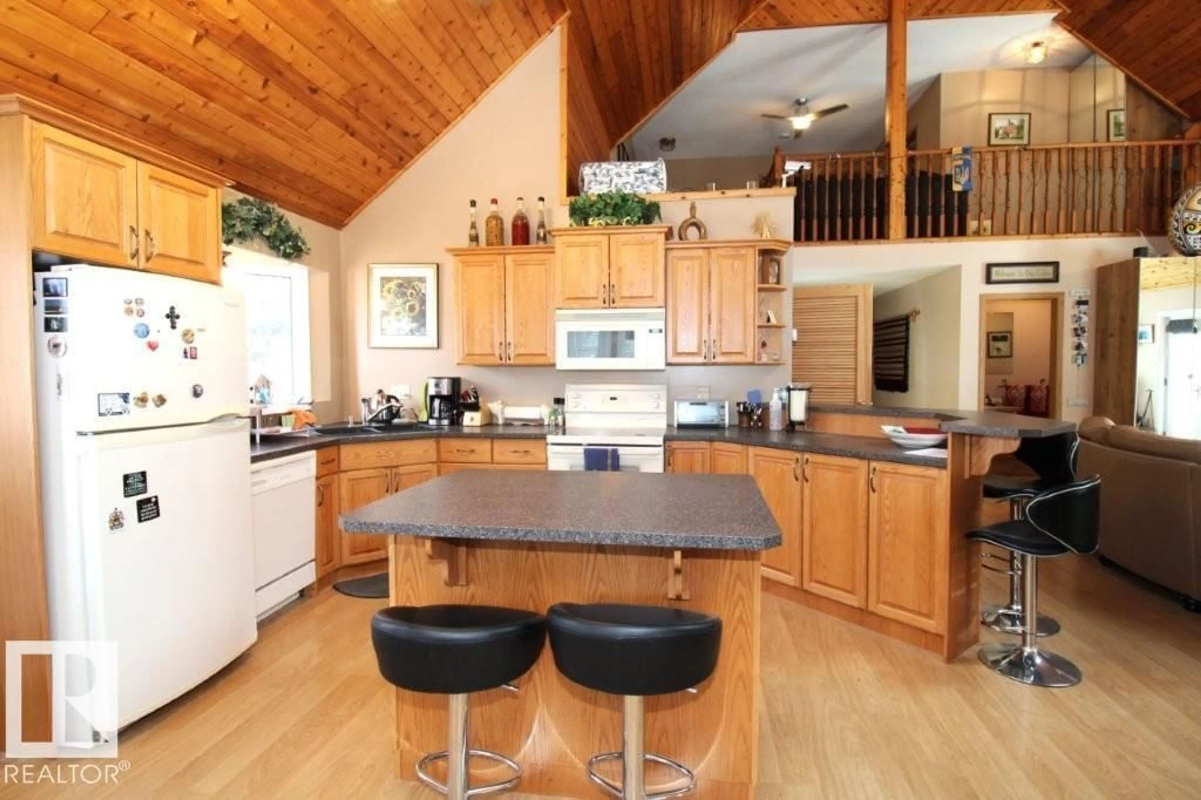 Open concept kitchen, wood/laminate floor for 6333 49 ST, Rural Wetaskiwin County Alberta T0C2C0