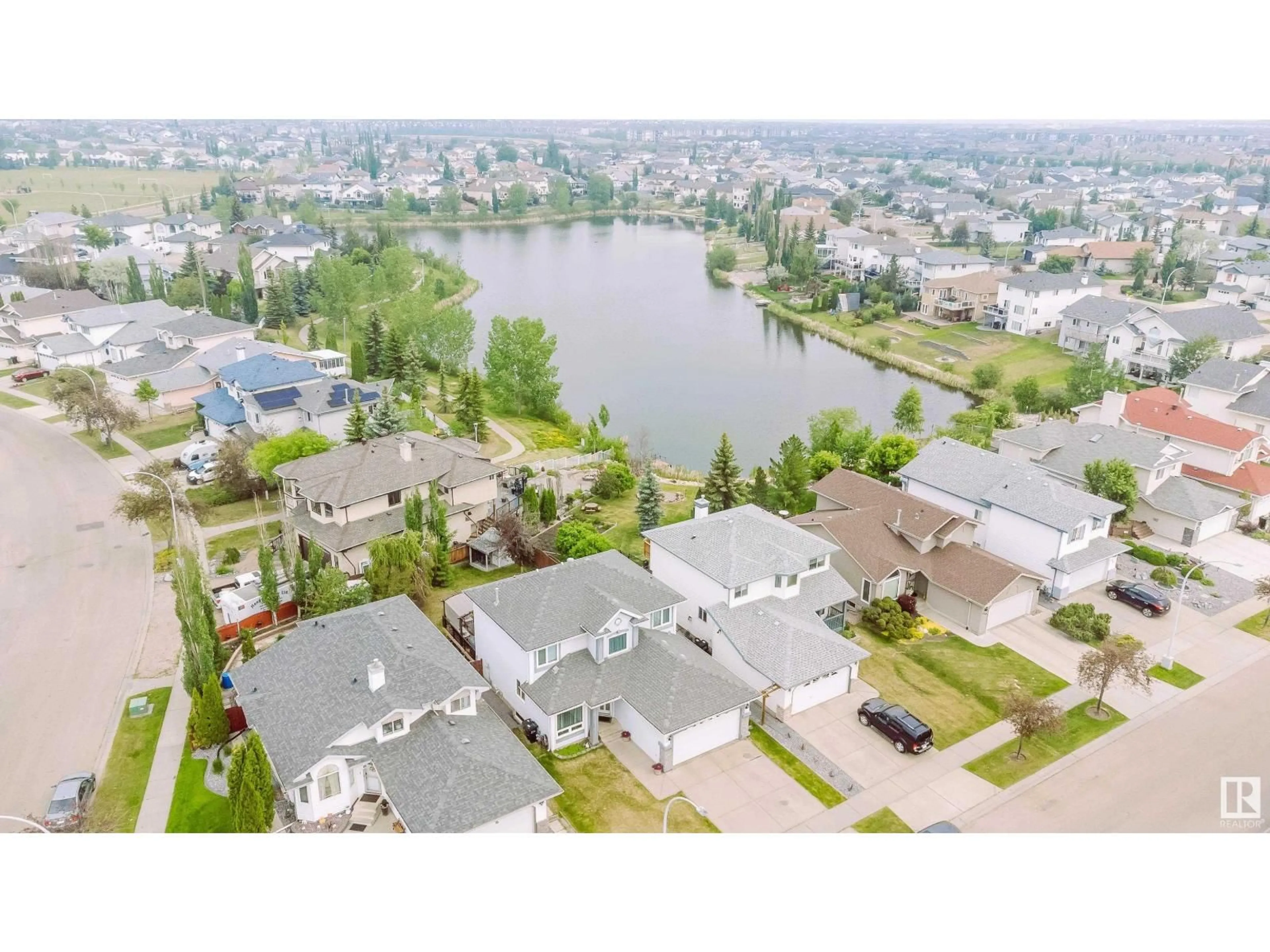 A pic from outside/outdoor area/front of a property/back of a property/a pic from drone, water/lake/river/ocean view for 442 KLARVATTEN LAKE WD, Edmonton Alberta T5Z3B9