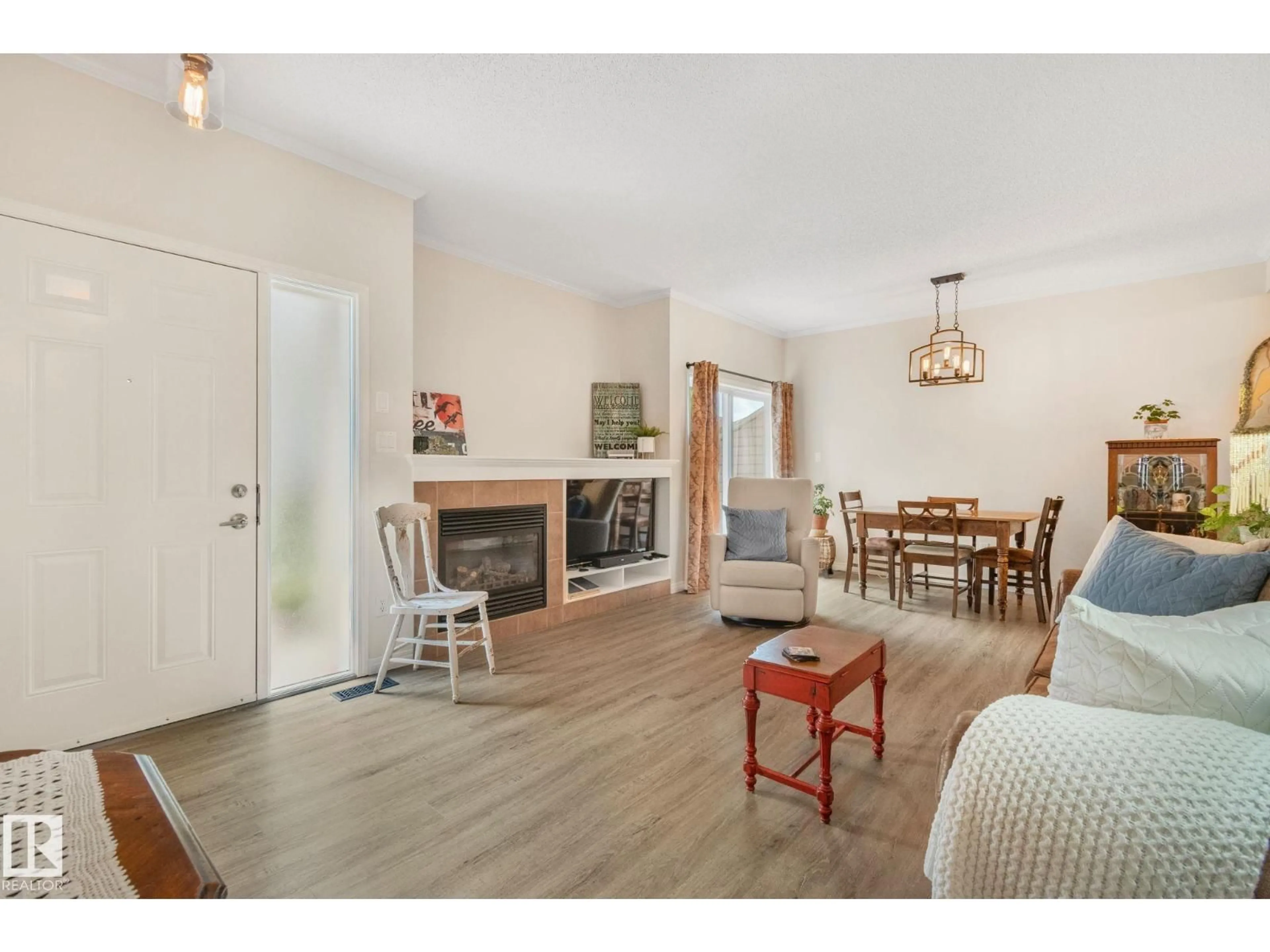 Living room with furniture, wood/laminate floor for #81 - 3040 SPENCE WD, Edmonton Alberta T6X1N7