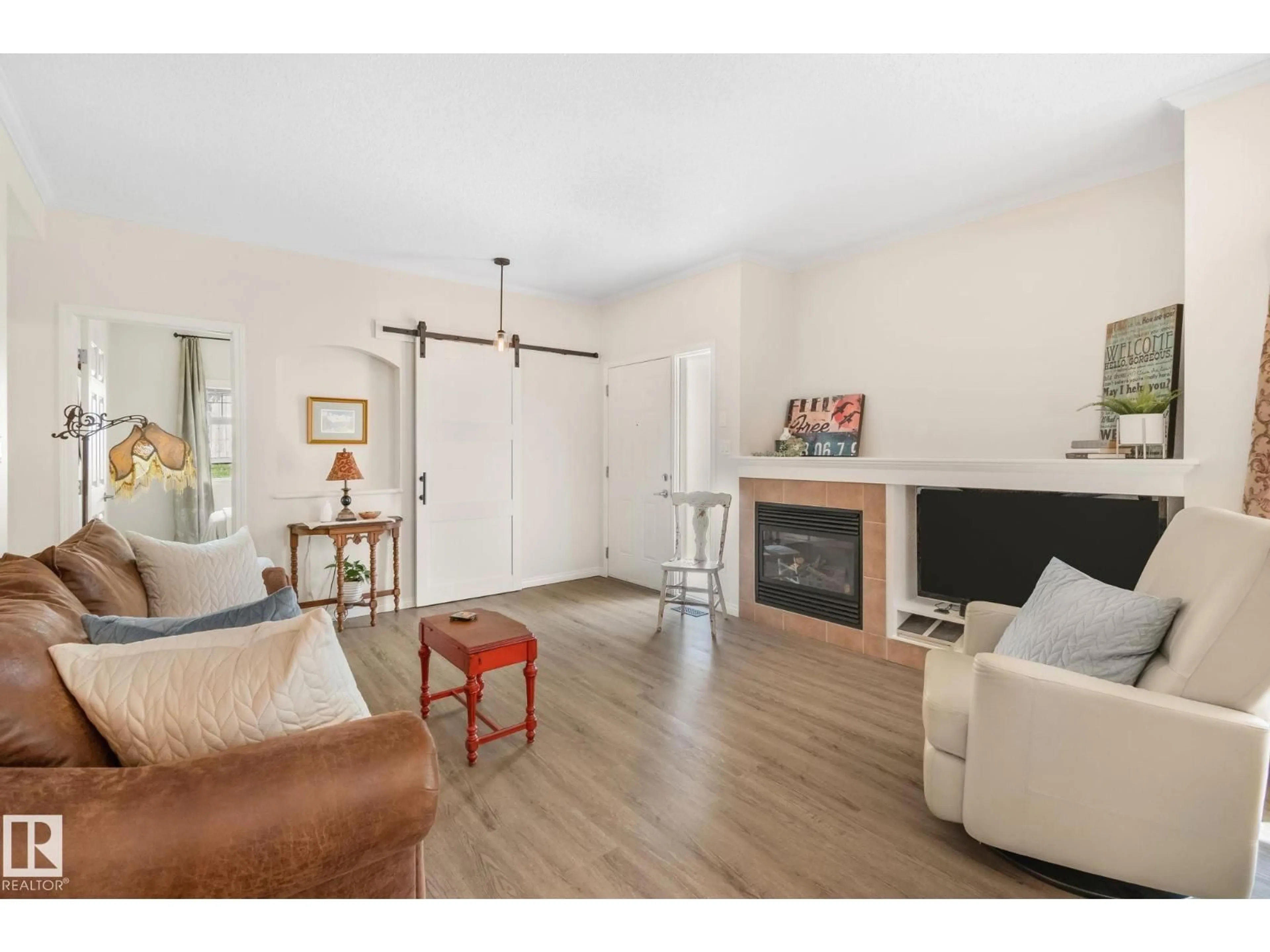 Living room with furniture, wood/laminate floor for #81 - 3040 SPENCE WD, Edmonton Alberta T6X1N7