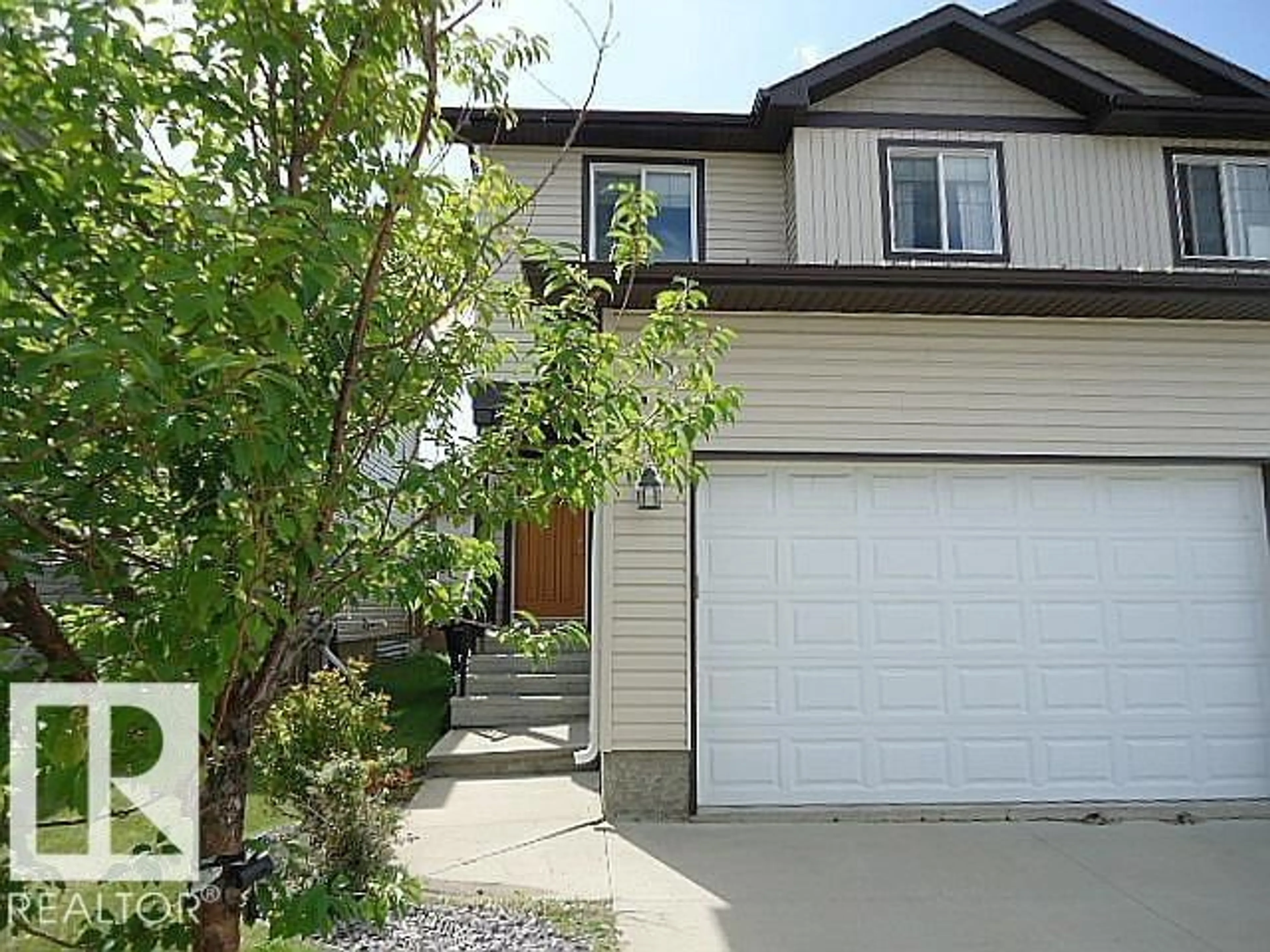 Home with vinyl exterior material, street for 37 ROSEBERRY LN, Fort Saskatchewan Alberta T8L0M6