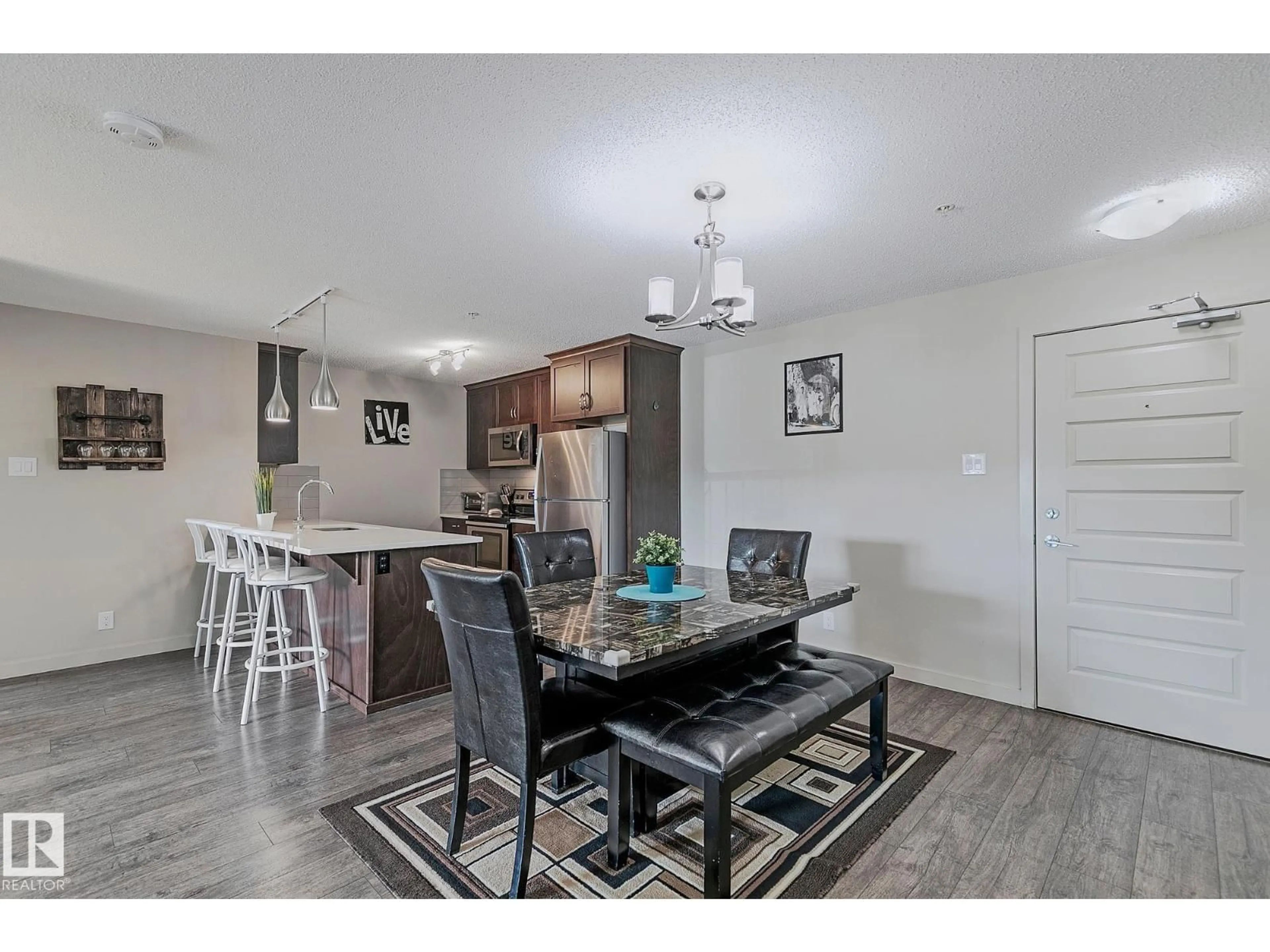 Open concept kitchen, unknown for #104 - 4008 SAVARYN DR, Edmonton Alberta T6X2E5