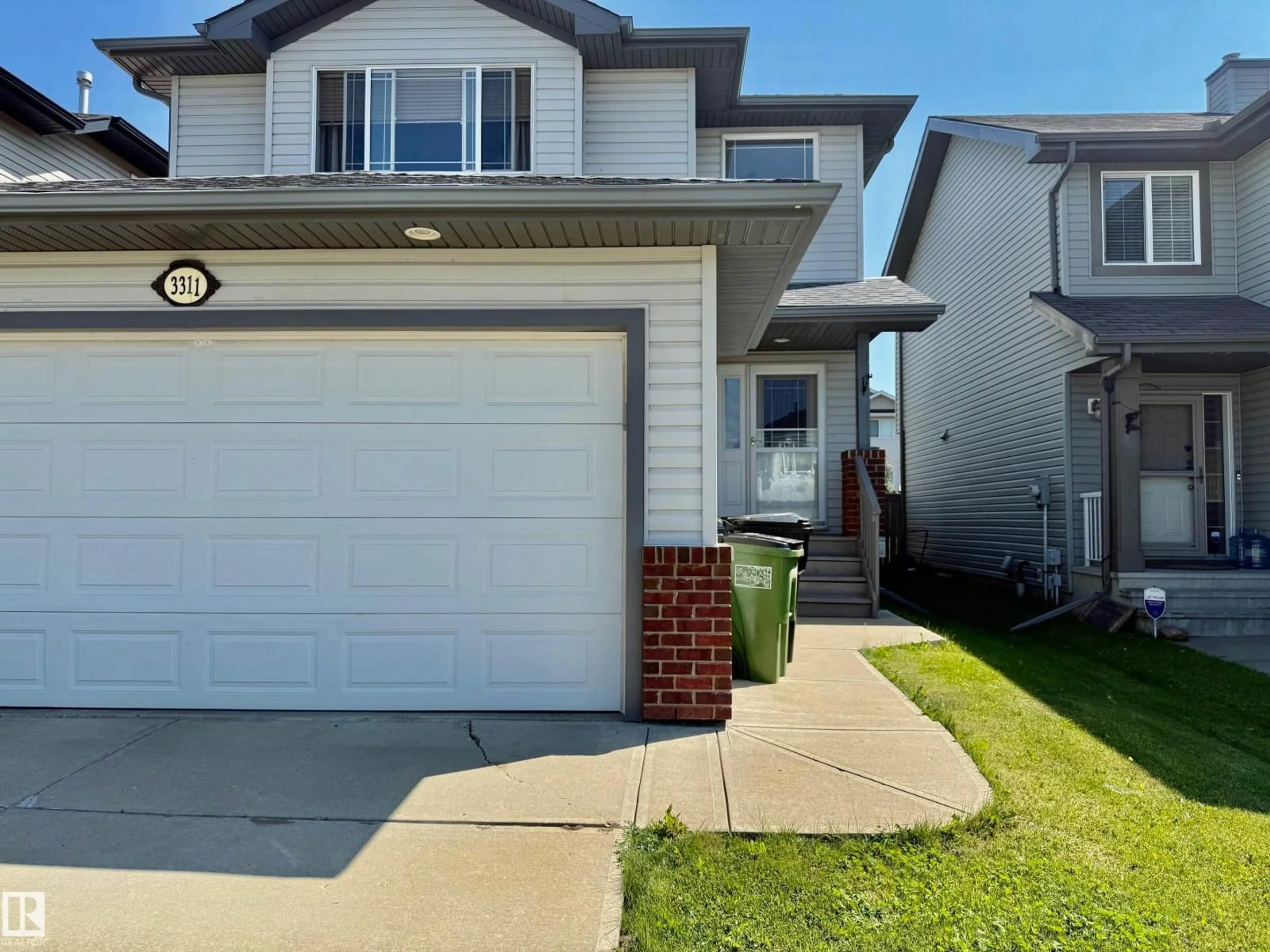 Home with vinyl exterior material, street for 3311 21 ST, Edmonton Alberta T6T0C4