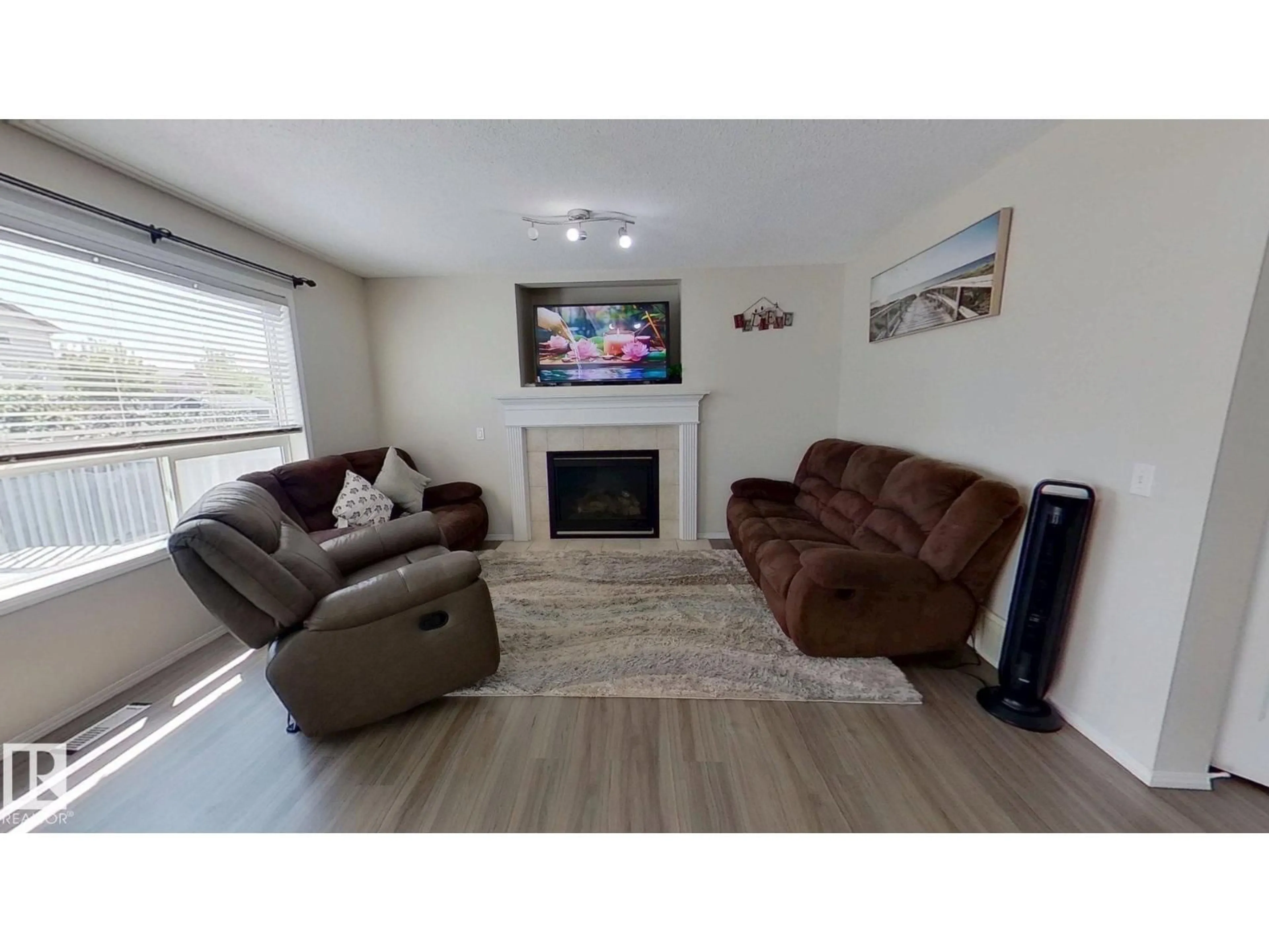 Living room with furniture, wood/laminate floor for 3311 21 ST, Edmonton Alberta T6T0C4