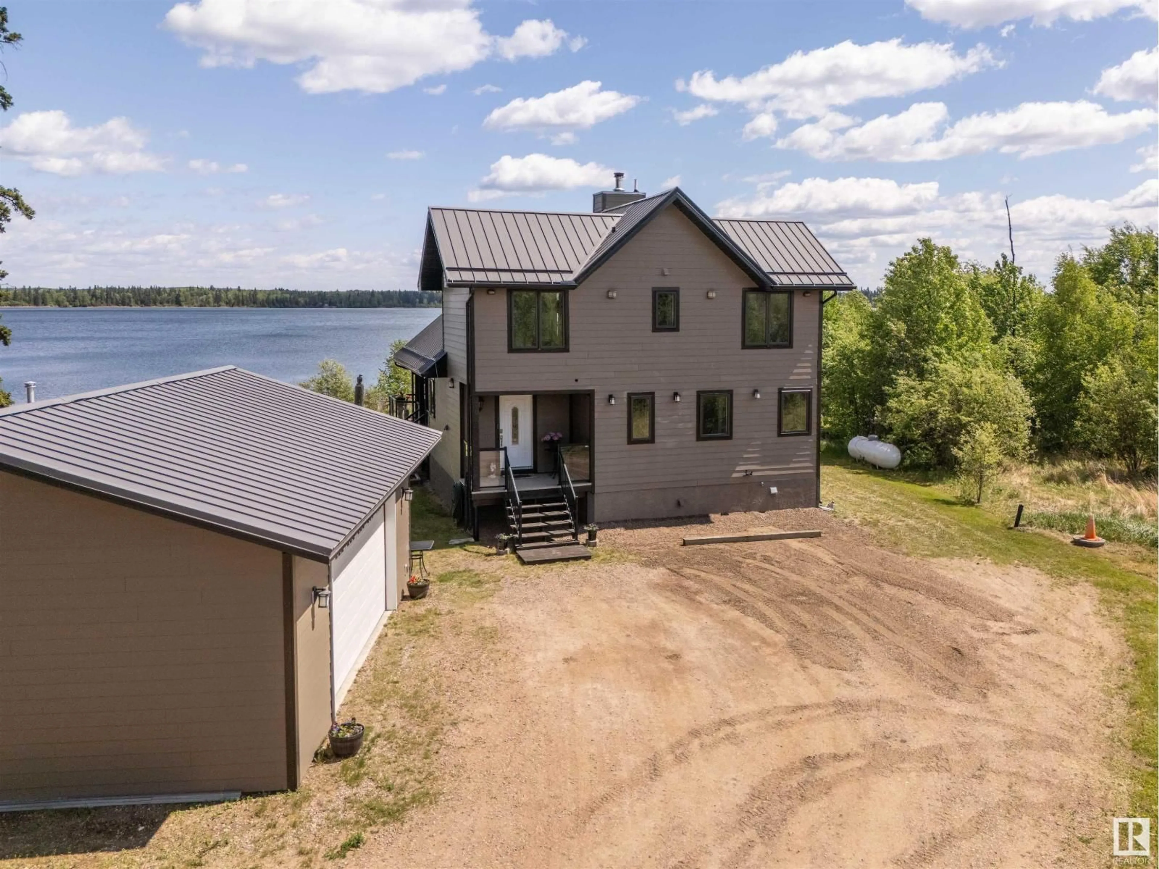 A pic from outside/outdoor area/front of a property/back of a property/a pic from drone, water/lake/river/ocean view for 43123 TWP RD 642 A, Rural Bonnyville M.D. Alberta T9M1P3