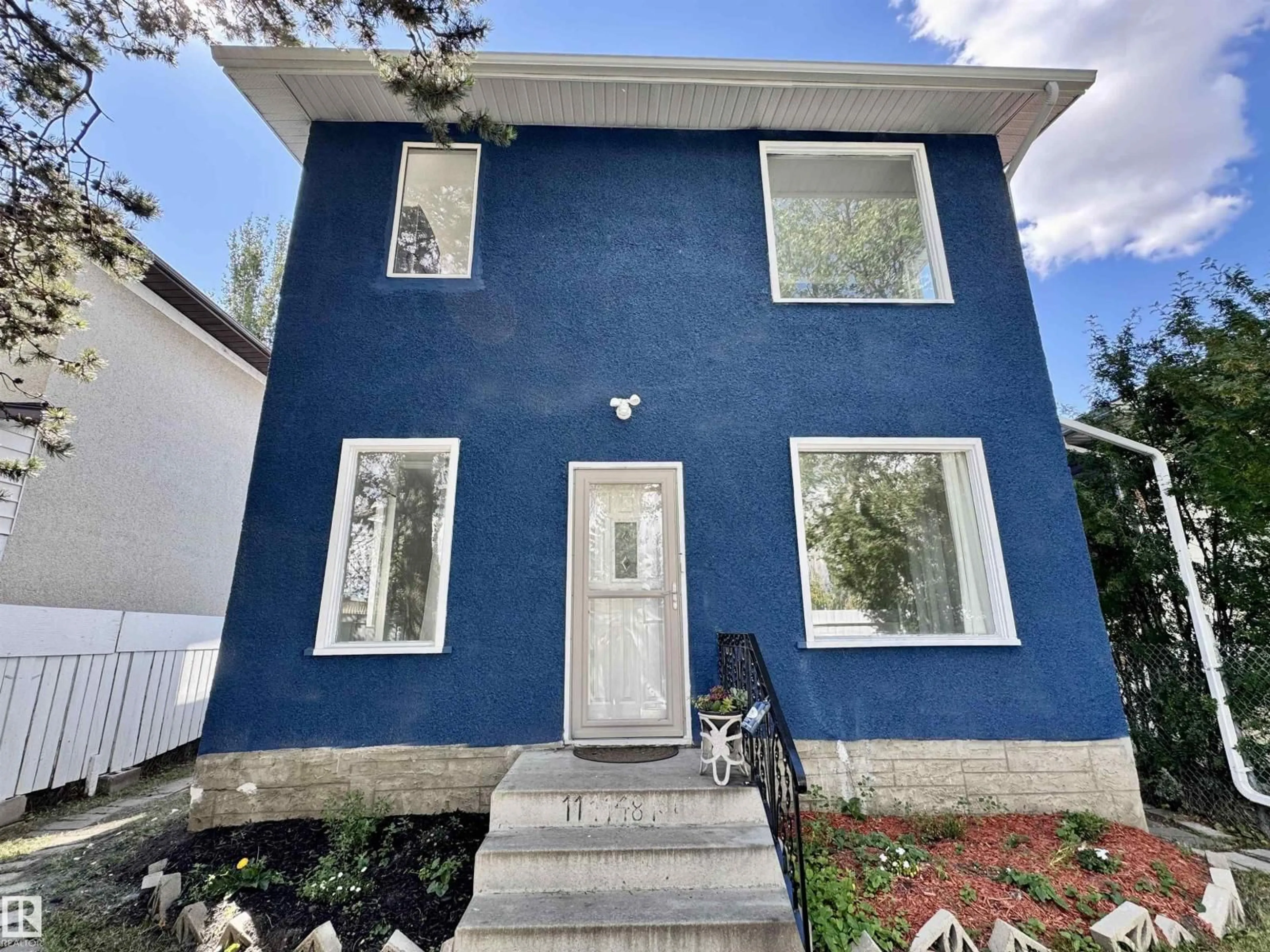 Home with vinyl exterior material, street for 11414 81 ST, Edmonton Alberta T5B2R6