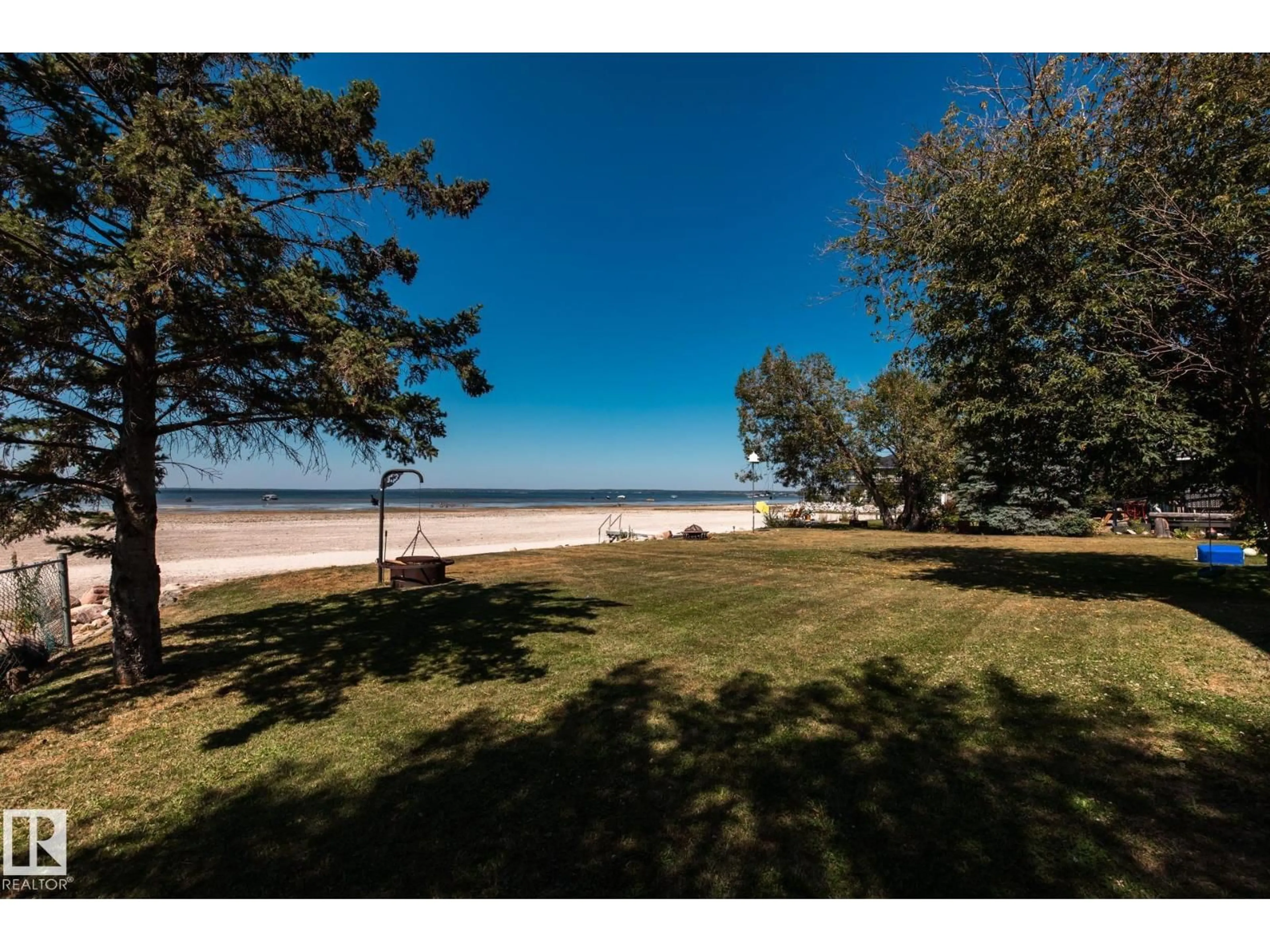 A pic from outside/outdoor area/front of a property/back of a property/a pic from drone, water/lake/river/ocean view for 4632 50 AV, Rural Lac Ste. Anne County Alberta T0E0A0