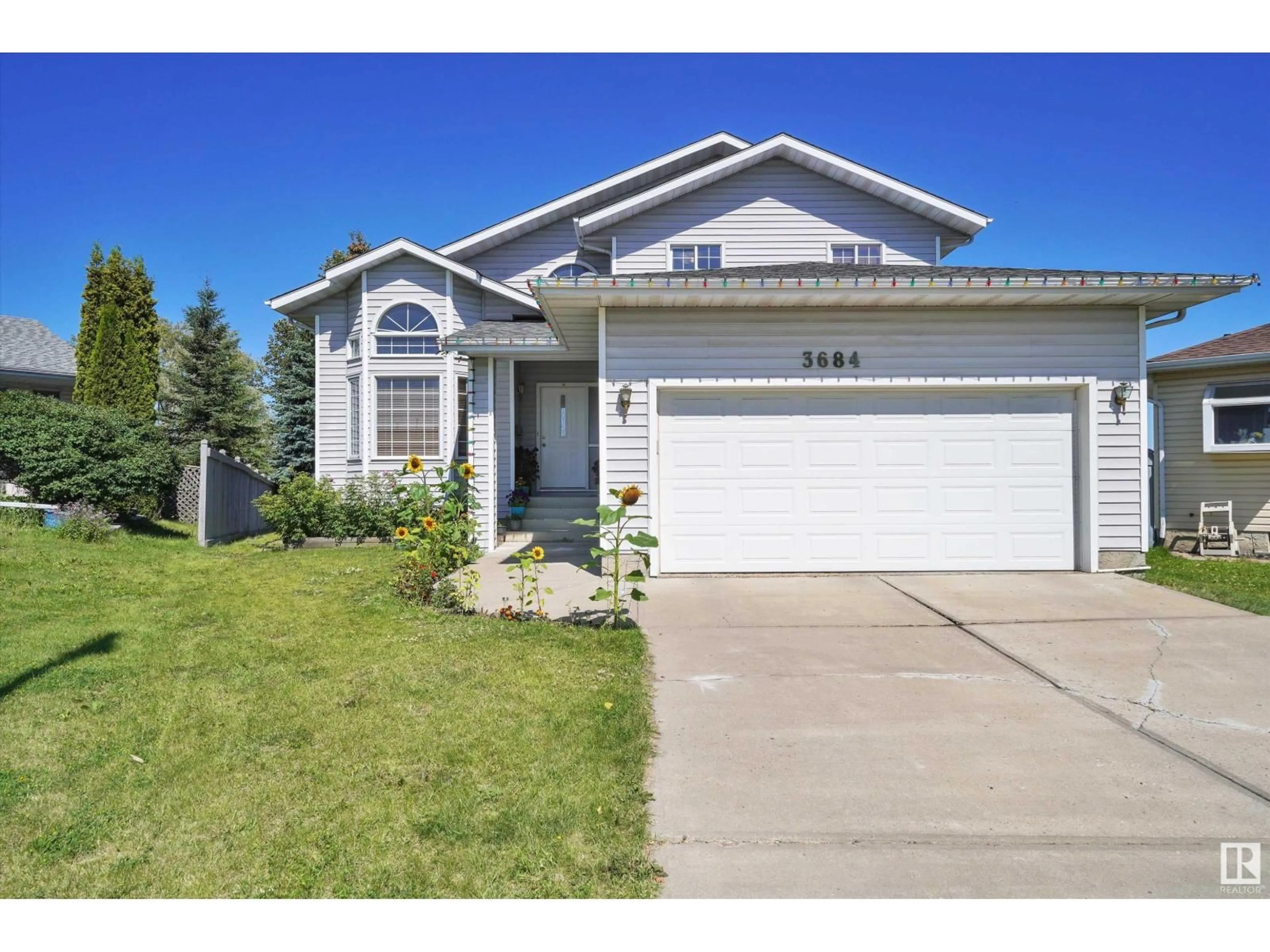 Home with vinyl exterior material, street for NW - 3684 33 ST, Edmonton Alberta T6T1G2
