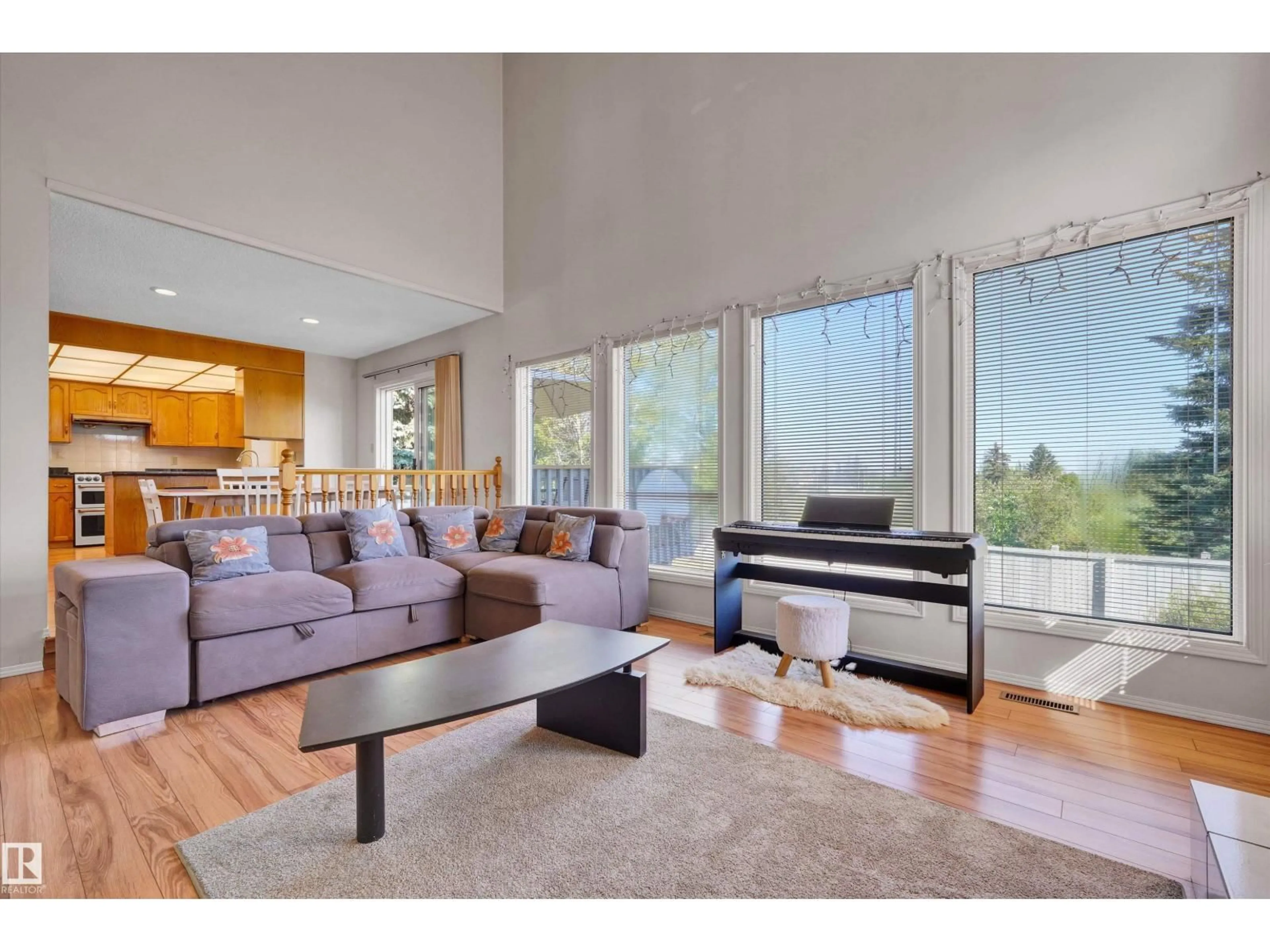 Living room with furniture, wood/laminate floor for NW - 3684 33 ST, Edmonton Alberta T6T1G2