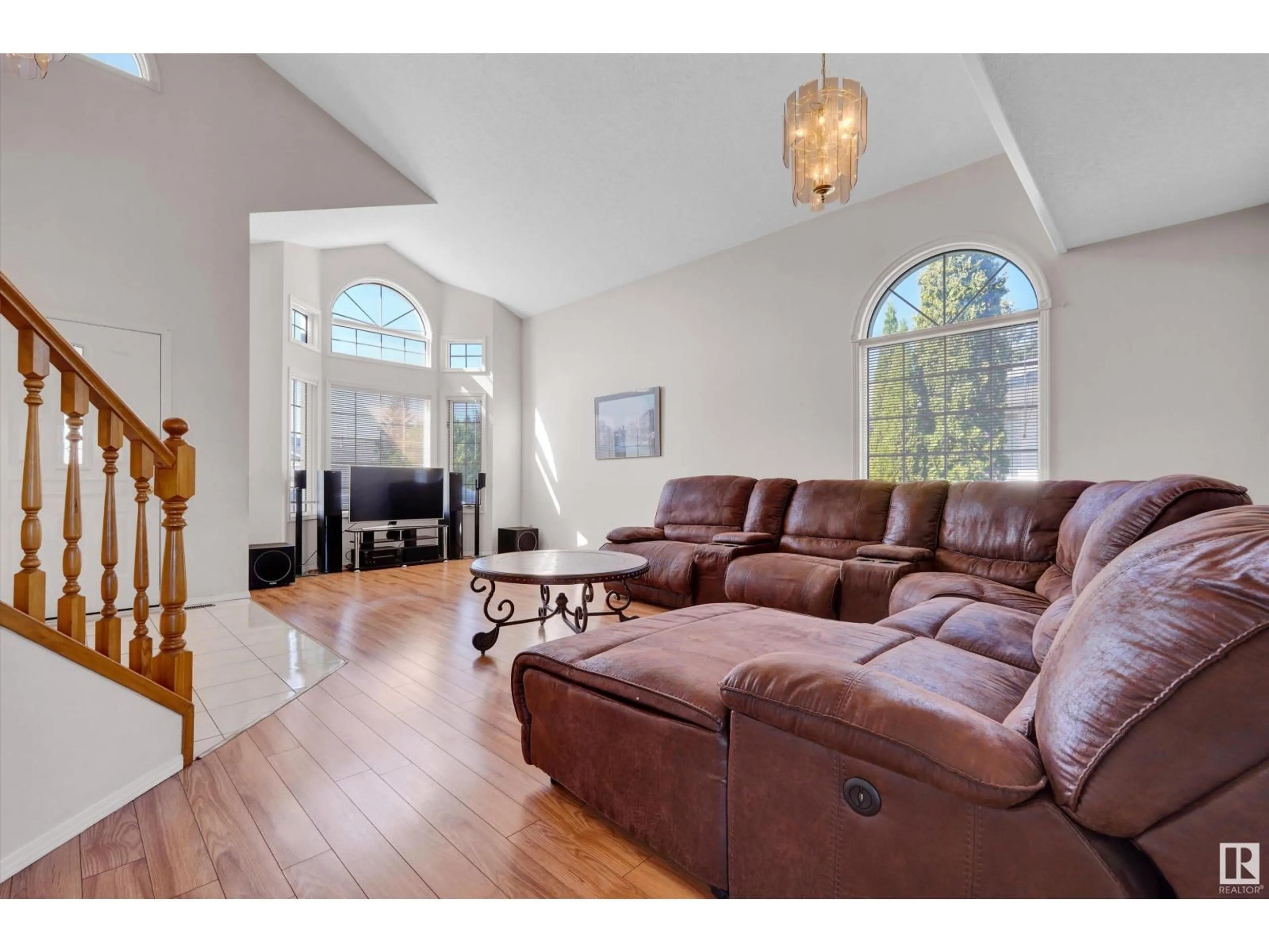 Living room with furniture, wood/laminate floor for NW - 3684 33 ST, Edmonton Alberta T6T1G2