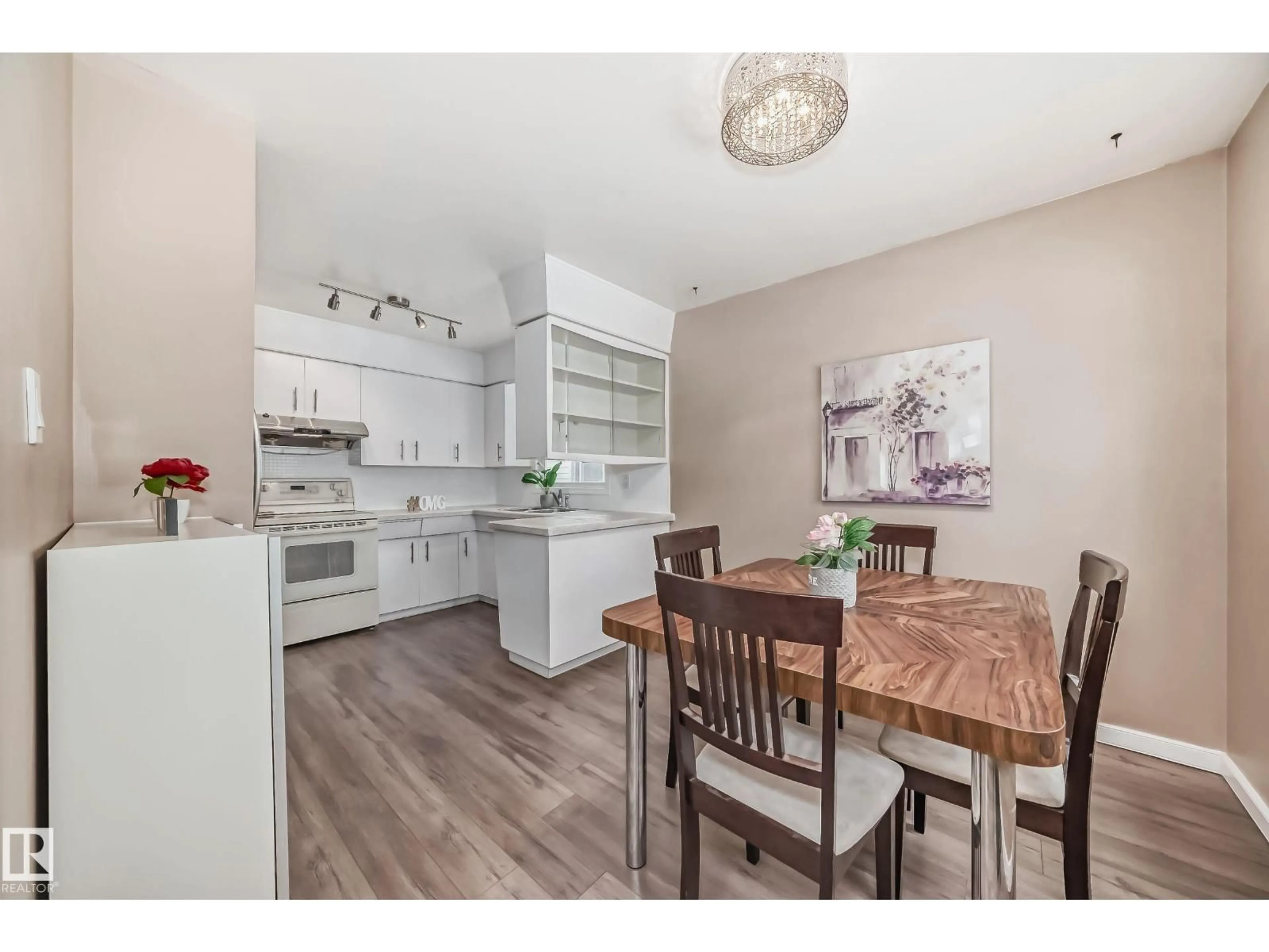 Open concept kitchen, wood/laminate floor for NW - 13028 65 ST, Edmonton Alberta T5A1A1