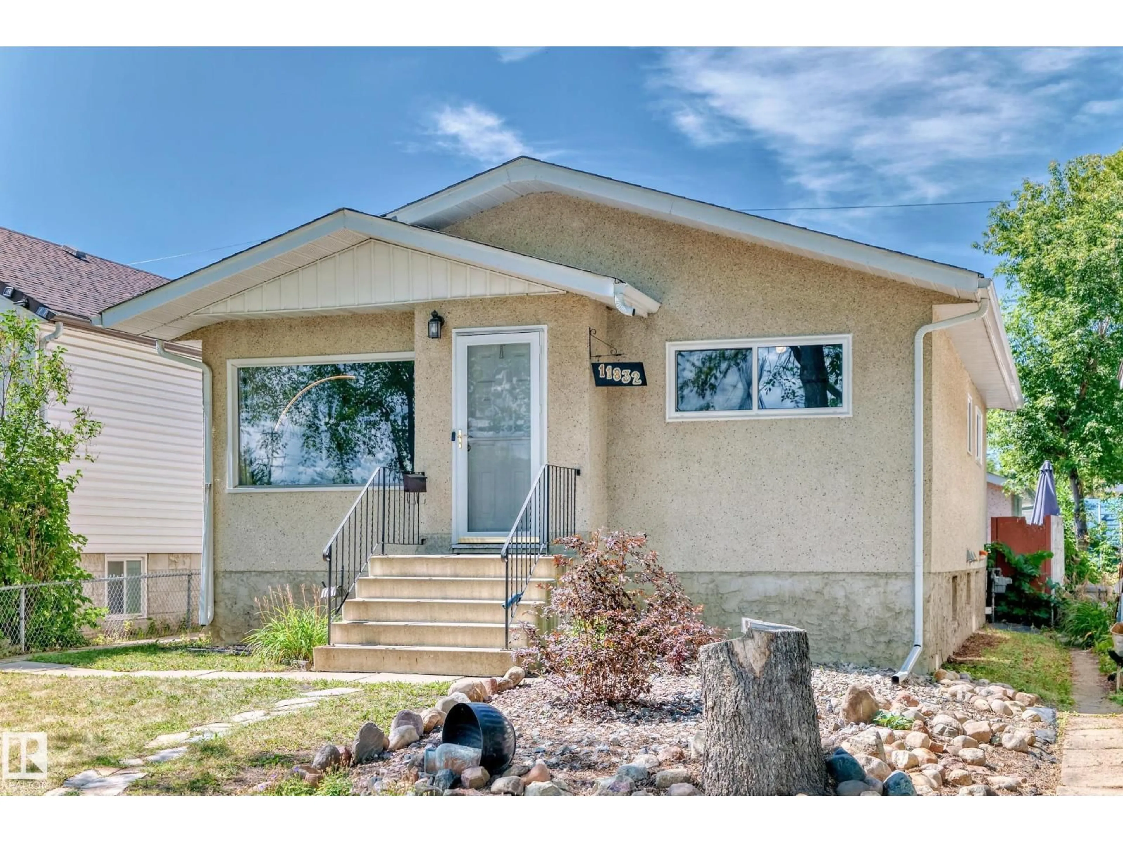 Home with vinyl exterior material, street for NW - 11832 64 ST, Edmonton Alberta T5W4J1