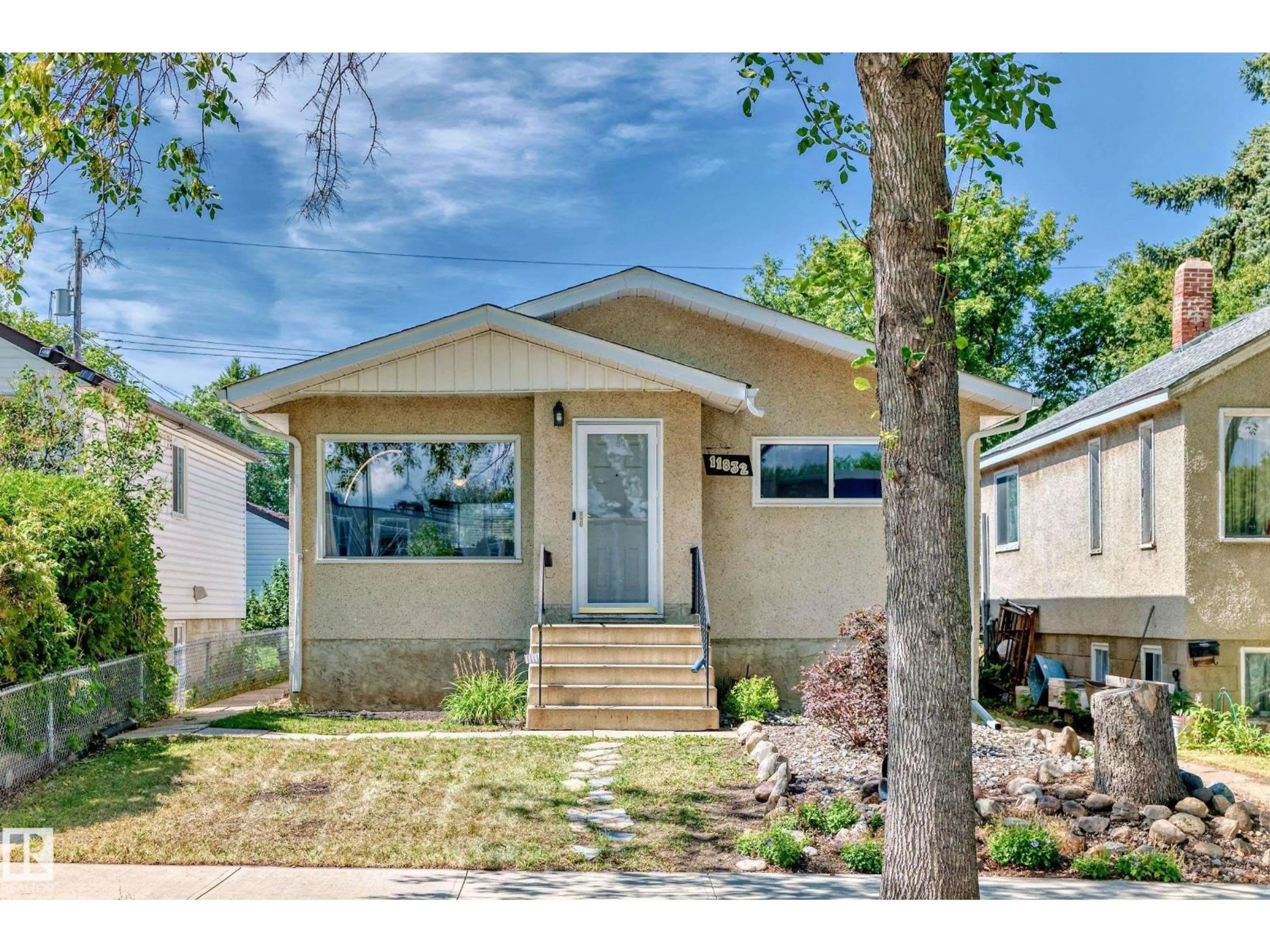 Home with vinyl exterior material, street for NW - 11832 64 ST, Edmonton Alberta T5W4J1