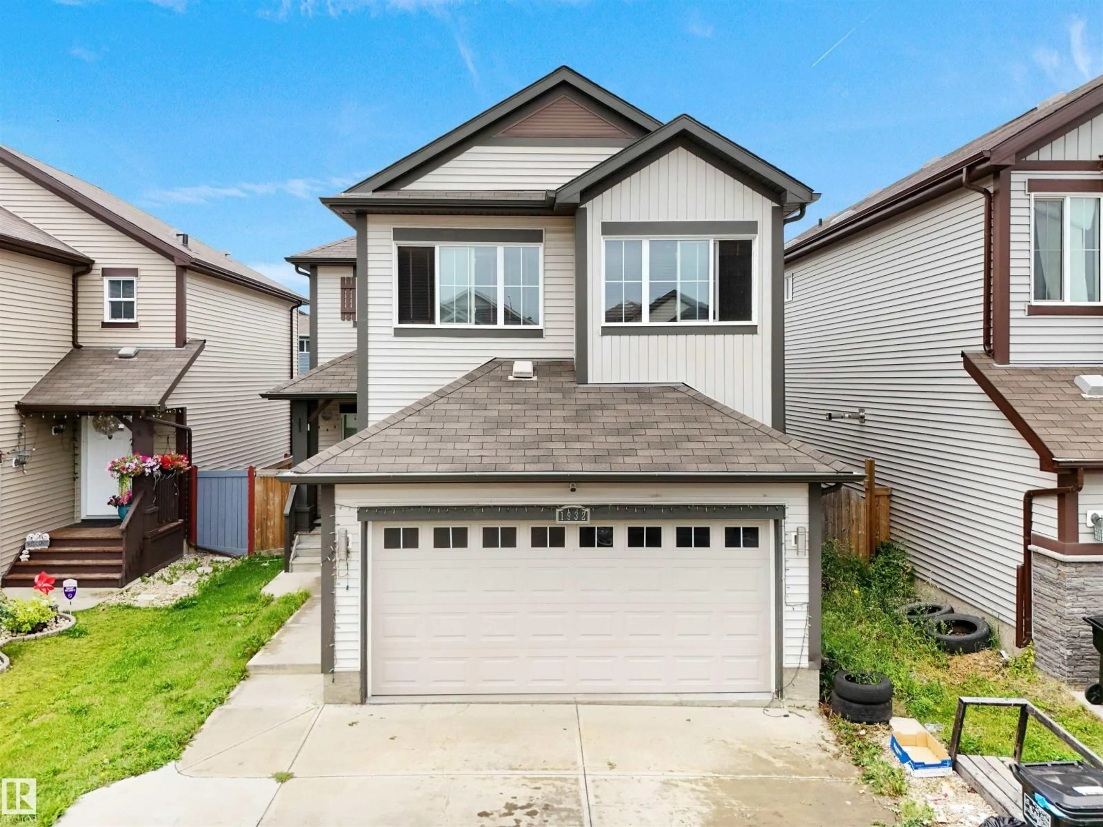 Home with vinyl exterior material, street for SW - 1932 51 ST, Edmonton Alberta T6X1Y4