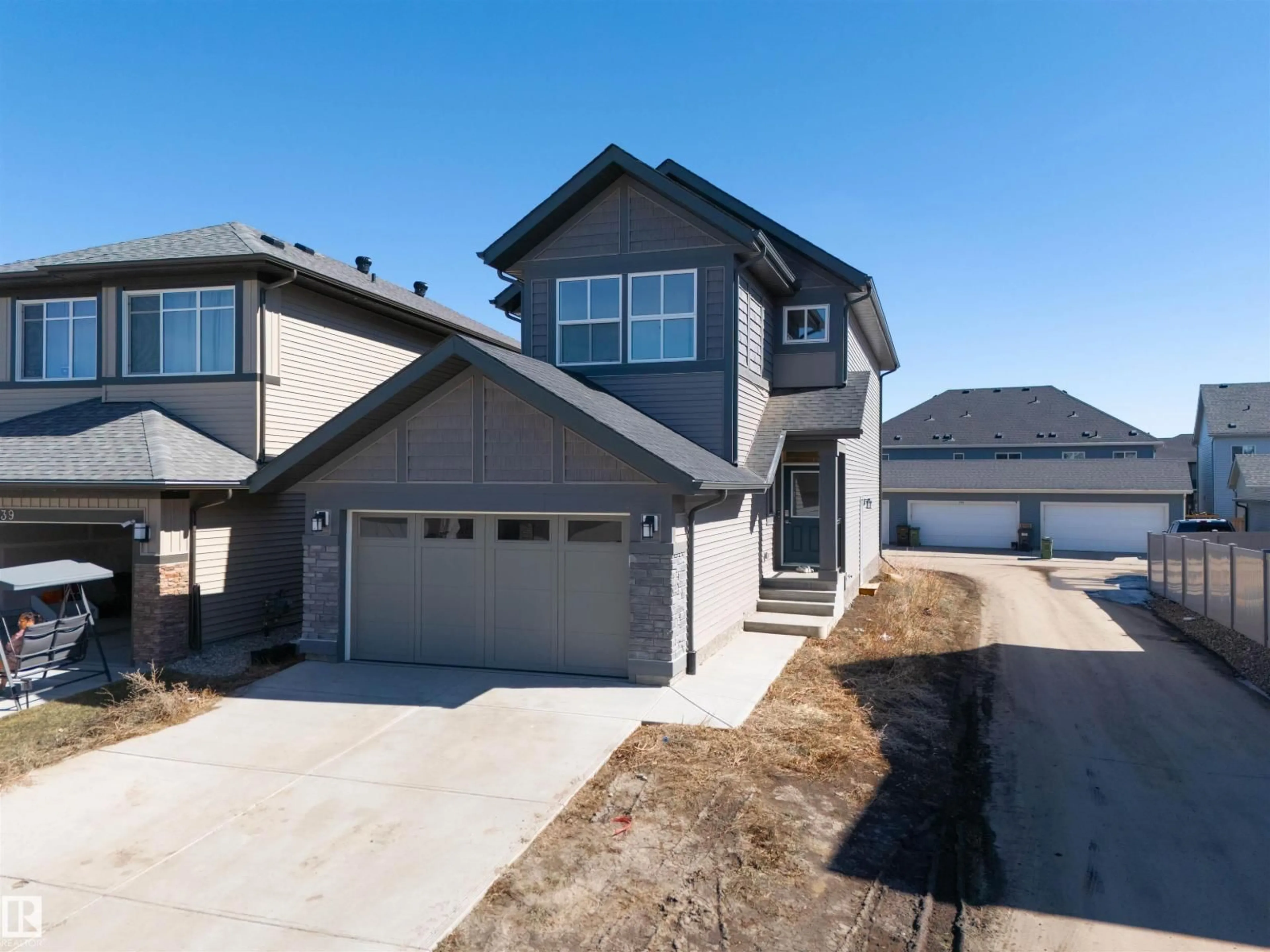 Home with vinyl exterior material, street for 9335 226 ST, Edmonton Alberta T5T7R5