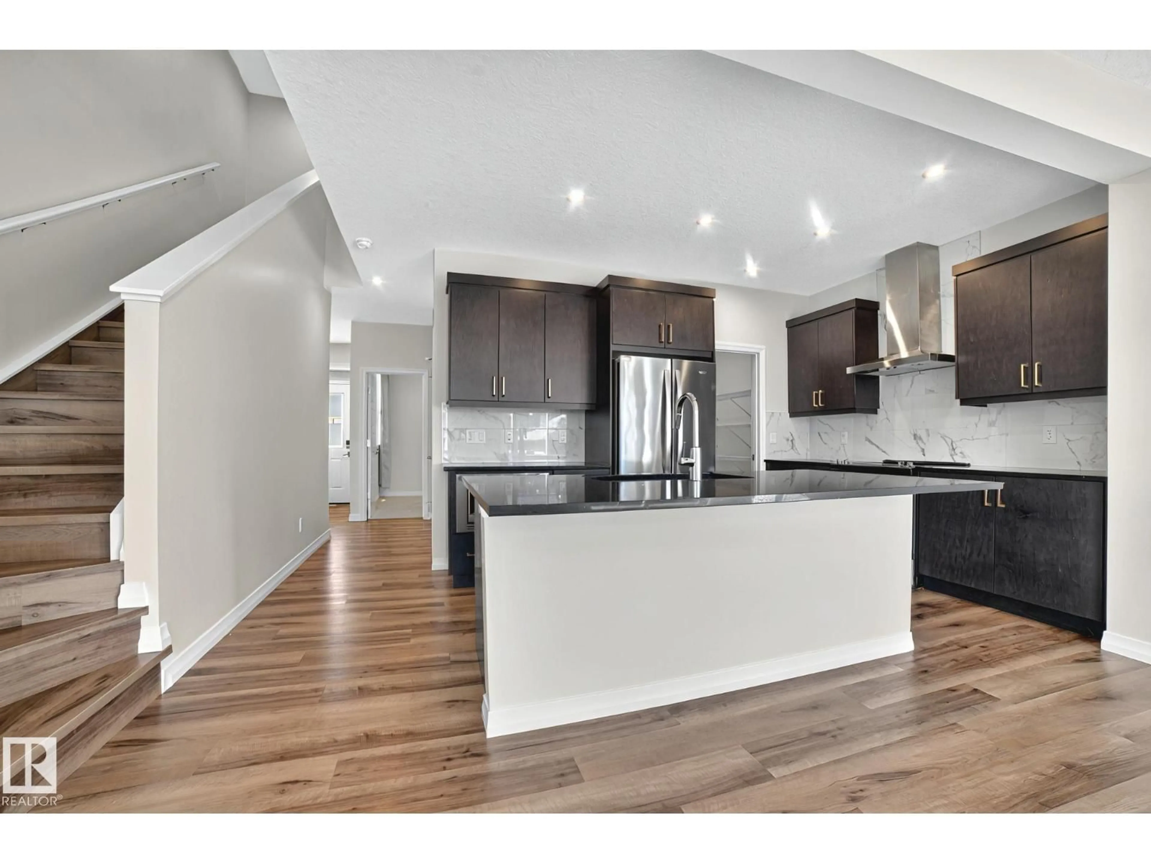 Open concept kitchen, wood/laminate floor for 9335 226 ST, Edmonton Alberta T5T7R5