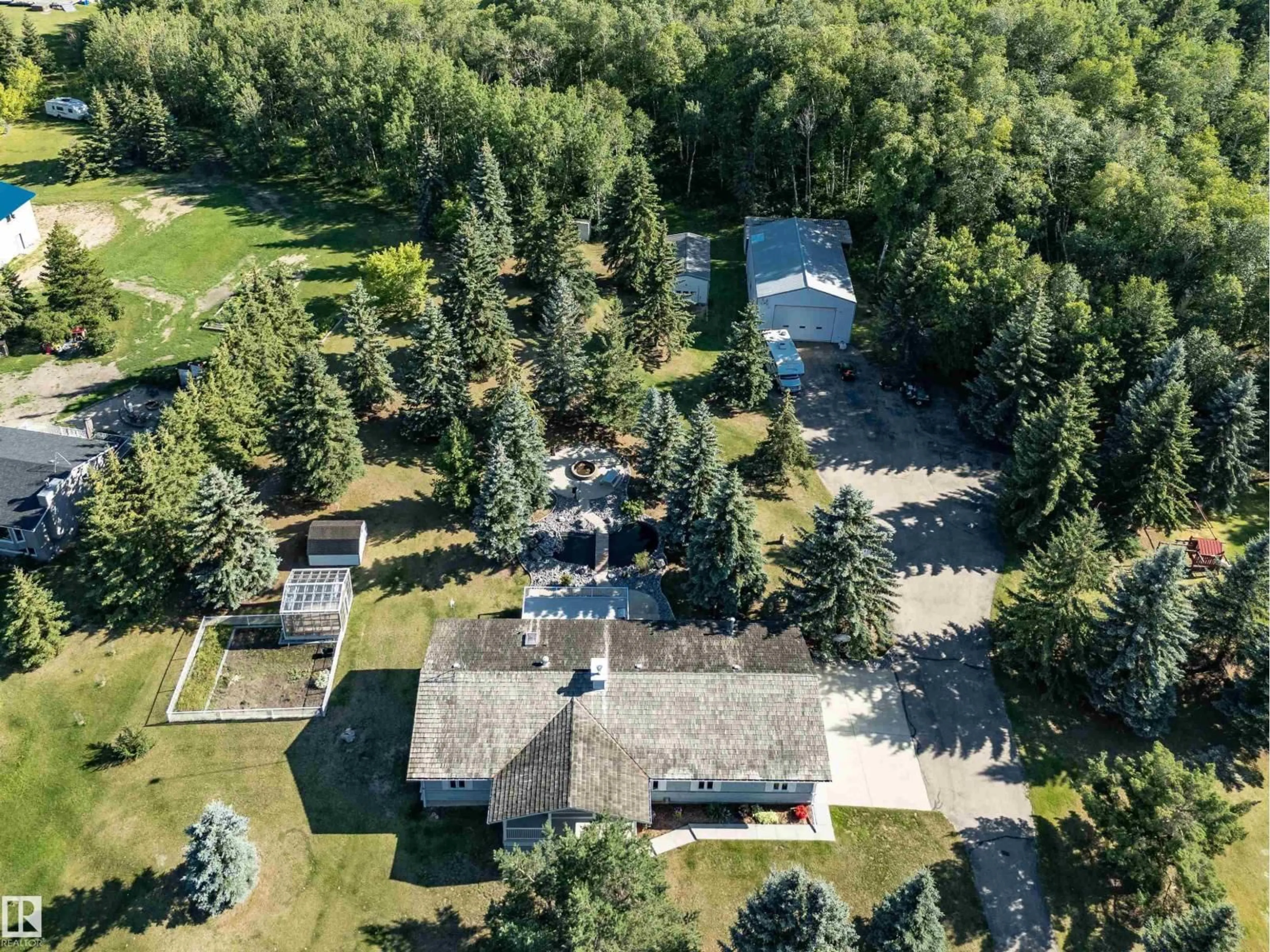 A pic from outside/outdoor area/front of a property/back of a property/a pic from drone, forest/trees view for 51128 - 29 RGE ROAD 261, Rural Parkland County Alberta T7X1B8