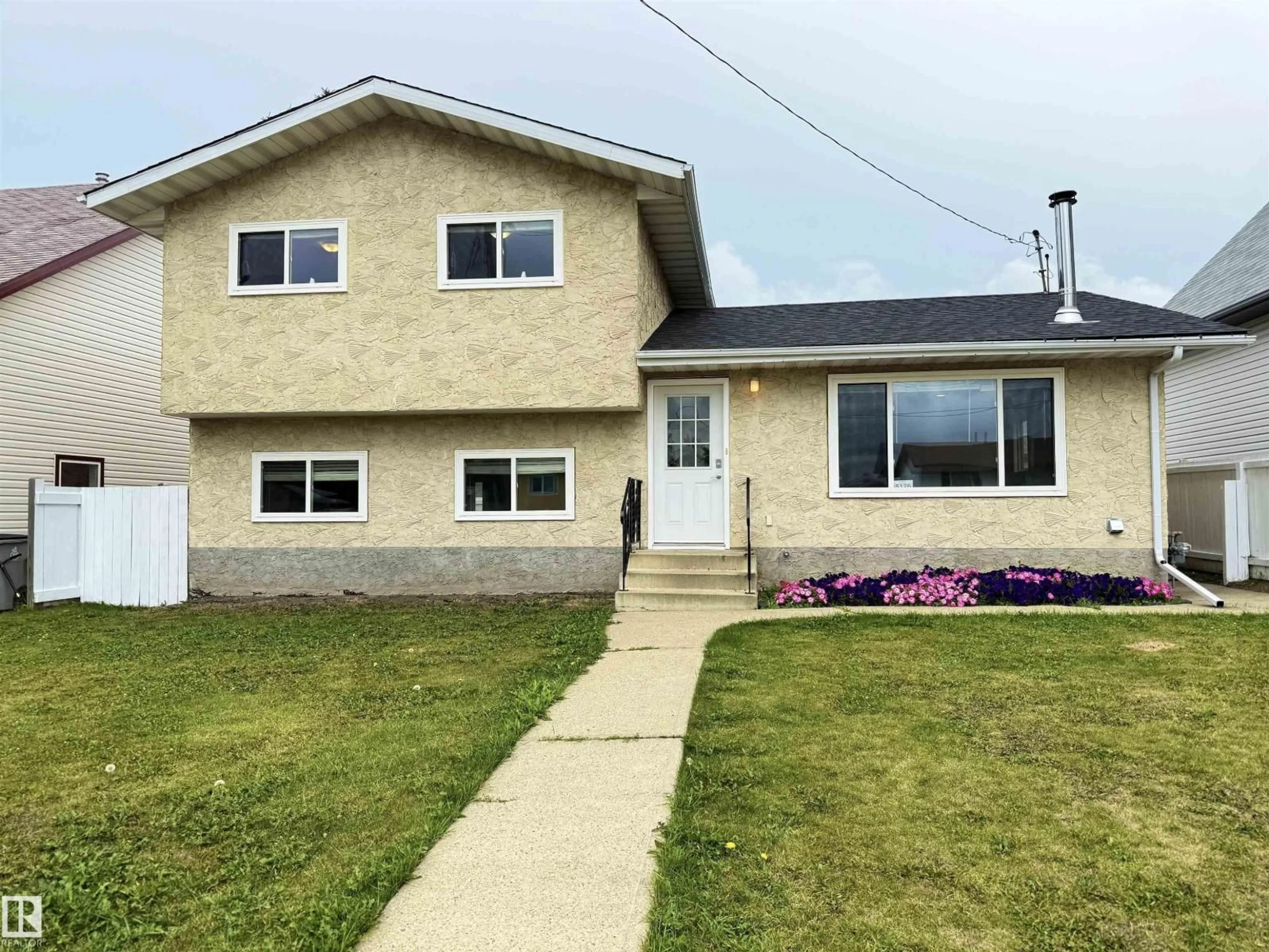 Home with vinyl exterior material, street for 5126 50 ST, Legal Alberta T0G1L0