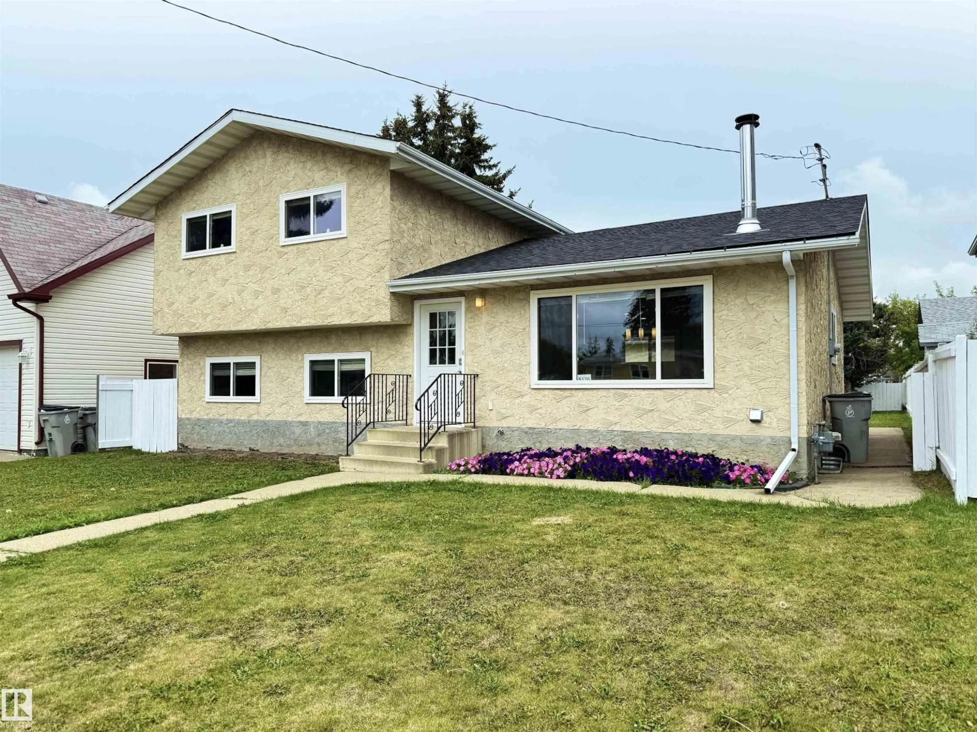 Home with vinyl exterior material, street for 5126 50 ST, Legal Alberta T0G1L0